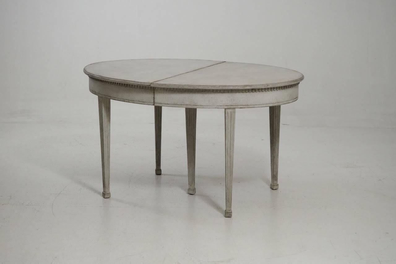 This is a stunning Swedish dining table in the Gustavian style with three leaves. Each leaf is 21.5