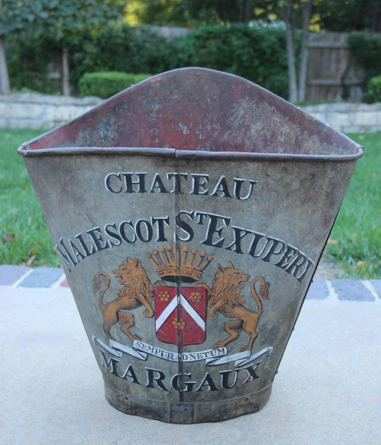 Late 19th century French zinc grape hod with back straps. These beautiful French grape hods were once used for picking grapes. This hod displays the Château Malescot St. Exupéry vineyard cote of arms from the Bordeaux region of France. 

These grape