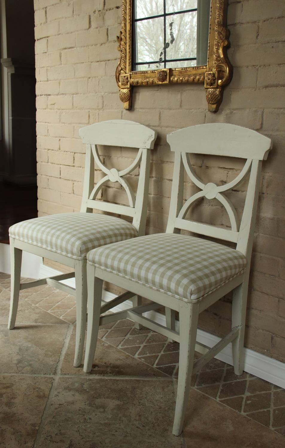 A pair of Swedish Gustavian style side chairs from the mid 19th century, newly upholstered in a beautiful Elizabeth Eakins linen check.