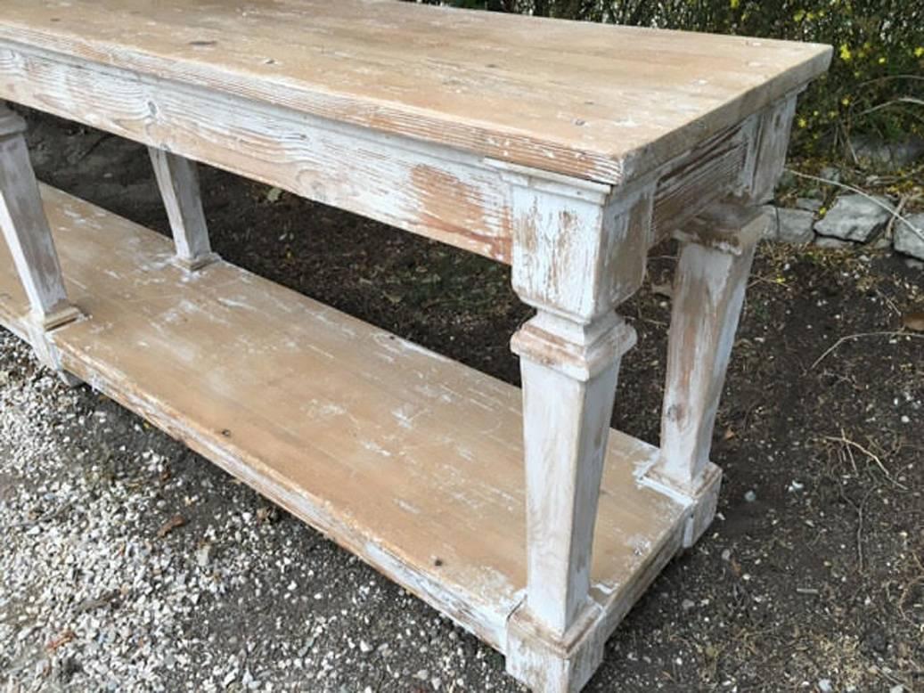 A spectacular French draper's table or console table in original paint with pot board.
