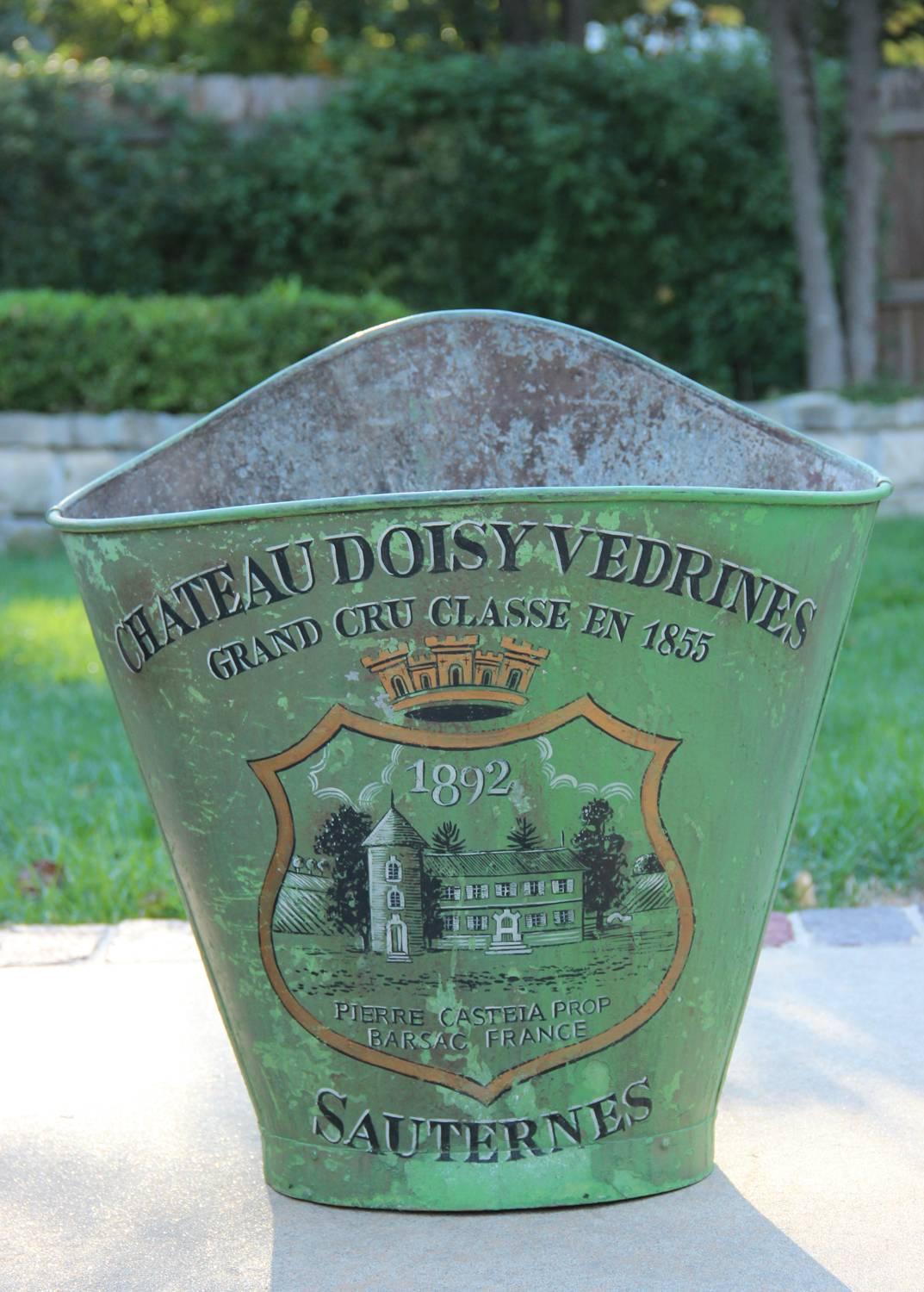 Late 19th century French zinc grape hods with back straps. These beautiful French grape hods were once used to pick grapes. This hod features the famous Château Doisy-Védrines vineyard cote of arms from Barsac, which is a small village south of
