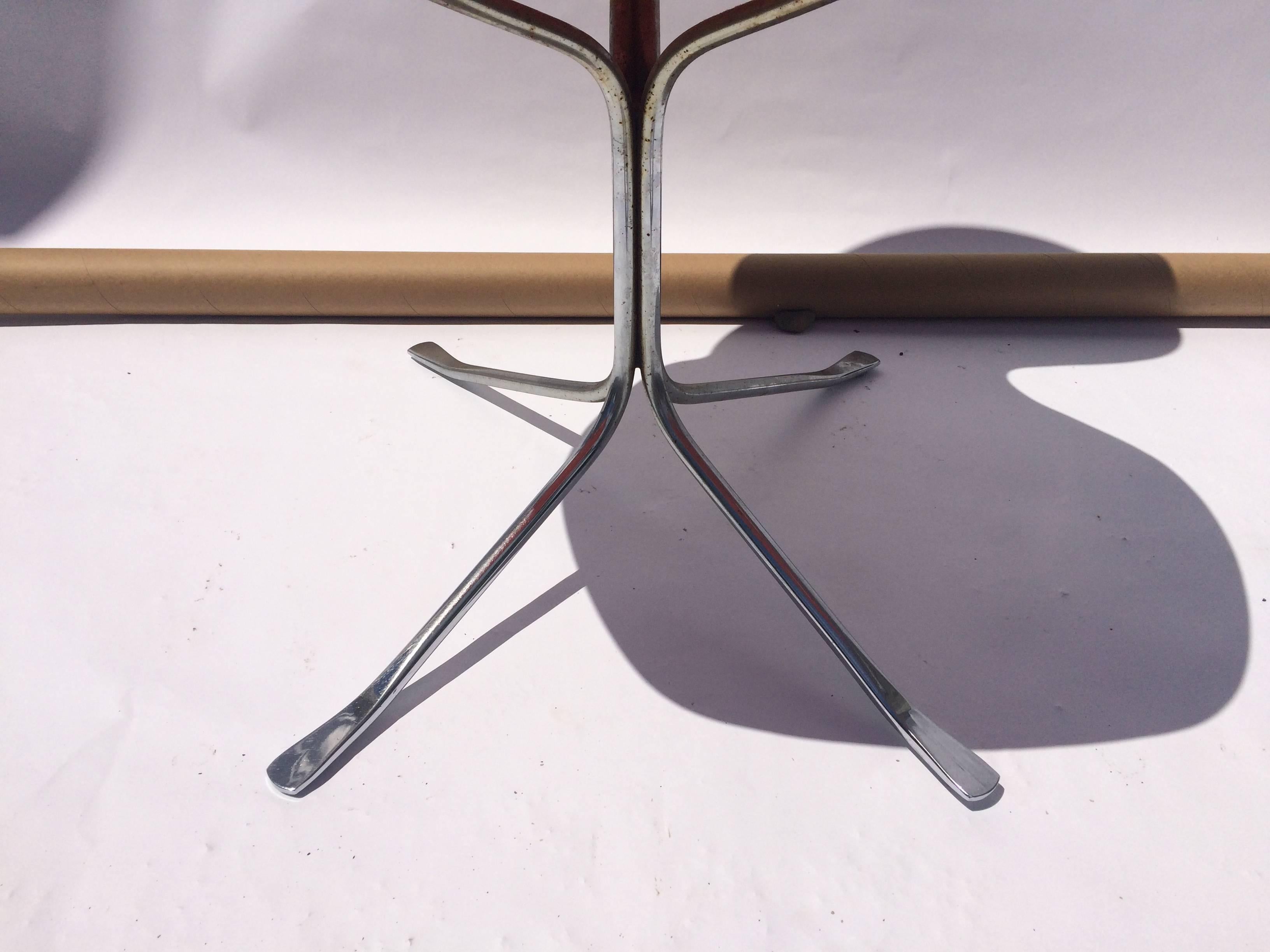 Fiberglass and chrome ion chair by Gideon Kramer.