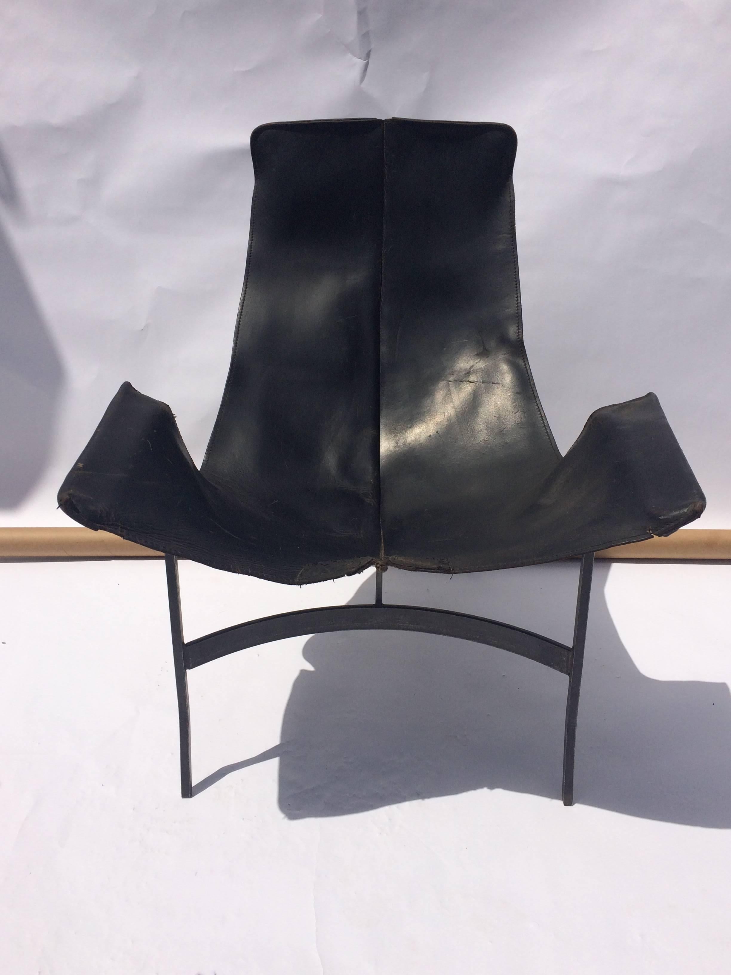 Beautifully distressed leather sling chair by William Katavolos for Leathercrafter. Maintaining its original black leather sling with wonderful repairing.