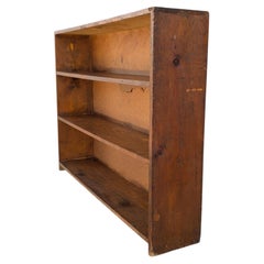 Librería baja rústica de madera, de estilo primitivo, de finales del siglo XX