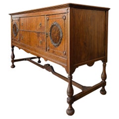 Antique Jacobean Revival Figured Wood Sideboard with Carved Medallions
