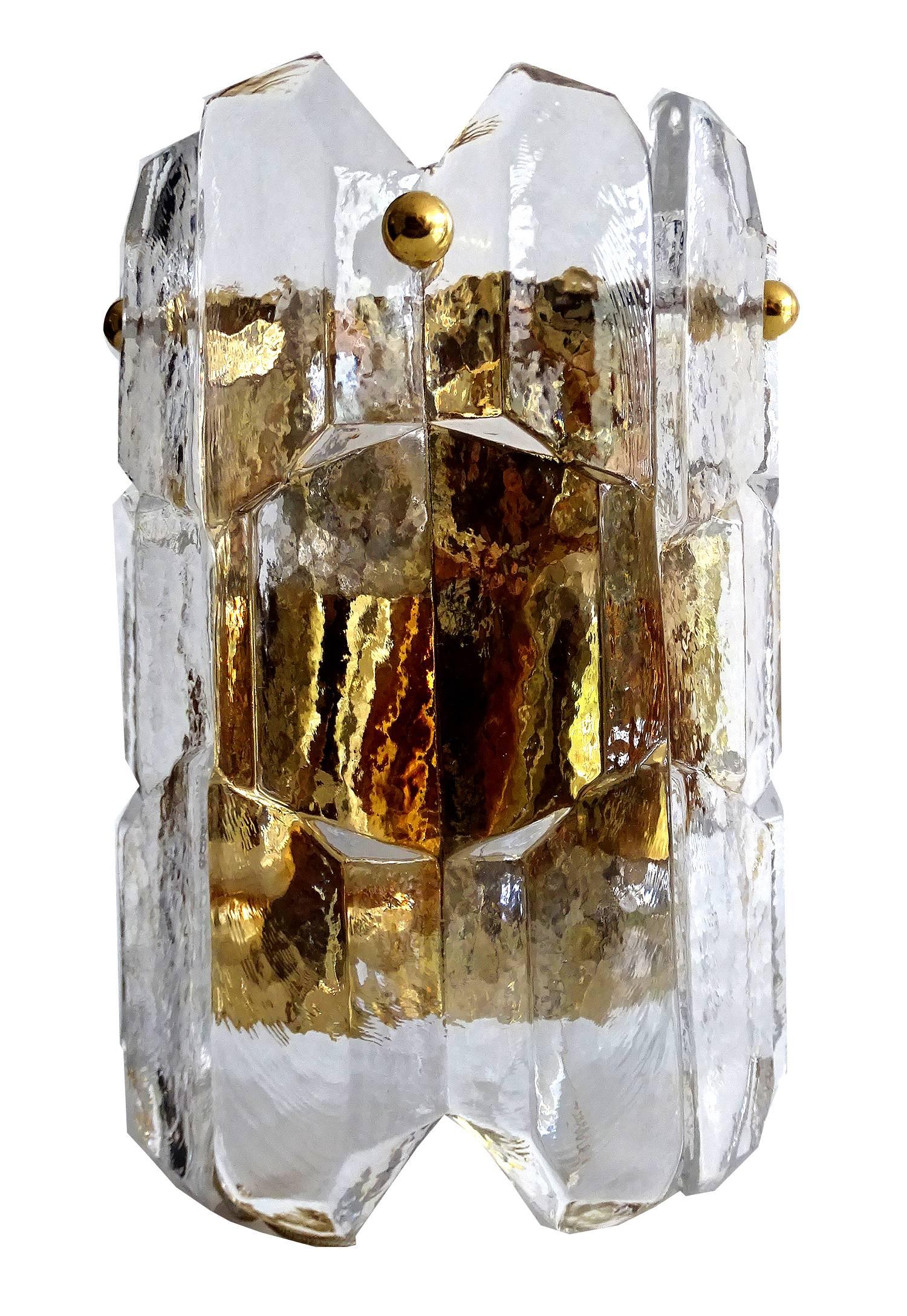 Rare and fabulous  vintage Mid-Century sconce by Kalmar with handcrafted Seguso Murano glass, it has a gilded brass base with two fittings,  each for e12 candelabra size screw bulbs to illuminate, and thick wet ice style prisms with a nice natural