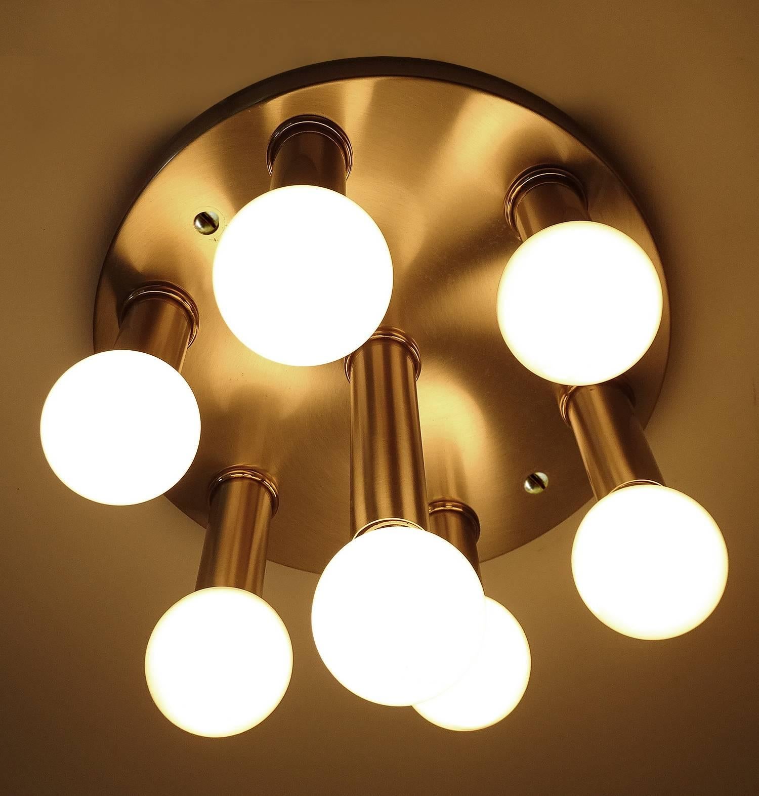 A flush mount light by Honsel, brushed stainless steel and brass trims.

Dimensions
8.66 in. / 22 cm H
Diameter
11.02 in. (28 cm)

Seven candelabra size bulbs, 40 watts each.