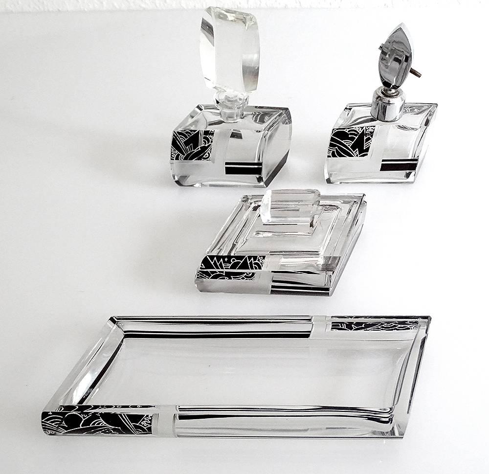 Exceptional Art Deco Karl Palda Bohemia crystal vanity set
with powder box, perfume bottle and eau de tollette spray
stunning Art Deco details like the extremely rare parallepepidic shape combined with
round shapes of the containers, engraved and