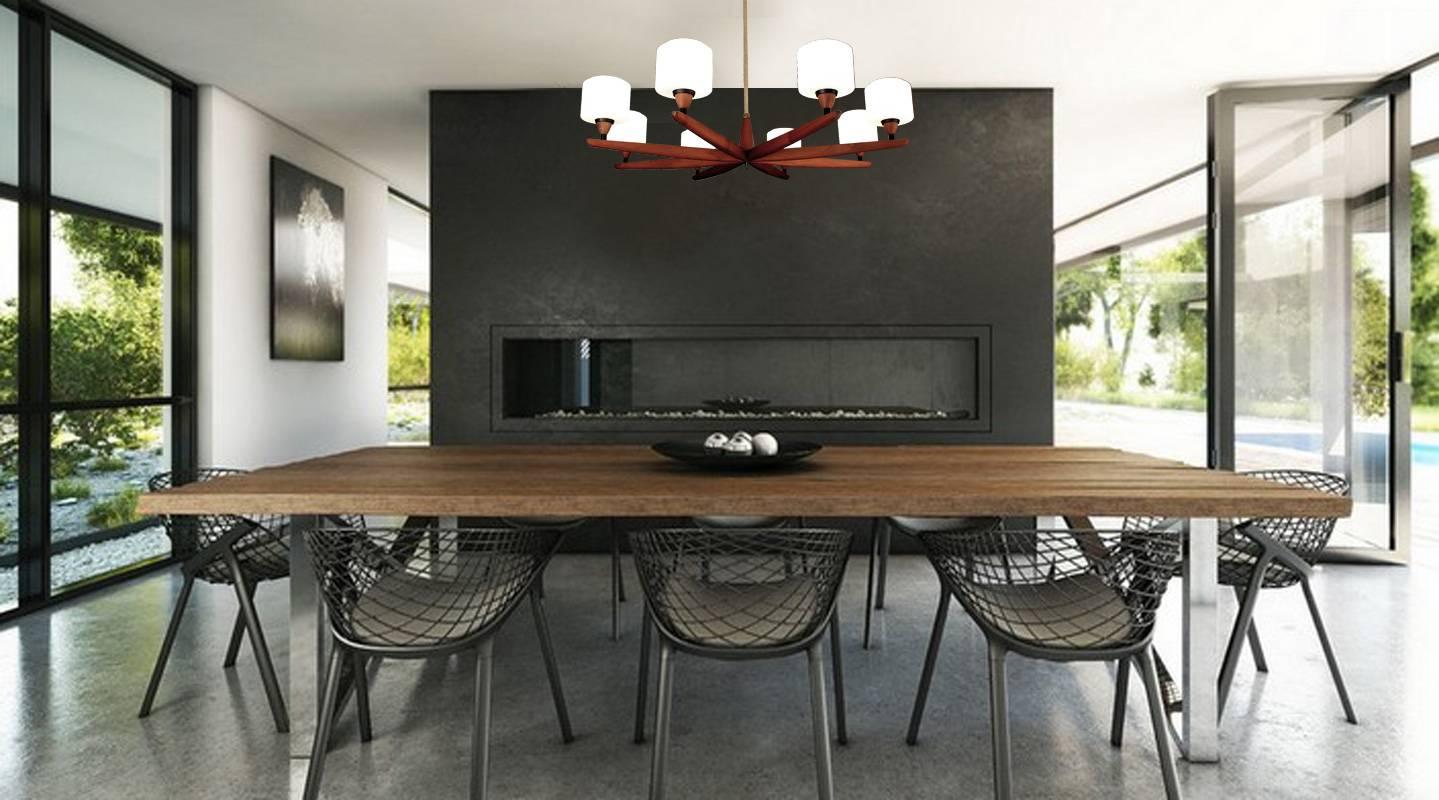 Very large sculptural teak and glass chandelier by Uno & Osten Kristiansson for Luxus. 

Eight candelabra size bulbs @ 40 watts. runs on voltage from 110 till 240 volts

Danish design  became famous and in high demand when Danish  designers