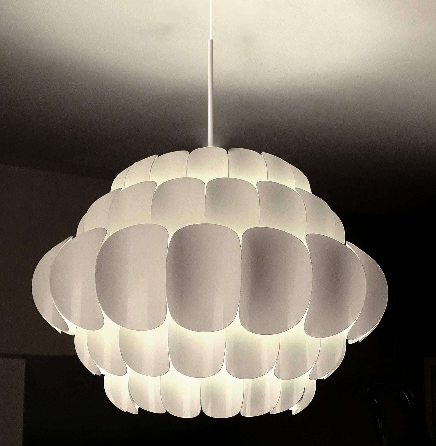 Dimensions
51.18 in.H / 130 cmH (cable can be shortened)
Diameter
22.44 in. (57 cm)

One standard bulb up to 200 watts. LED compatible

Very large chandelier by Theodor Müller  featuring five tiers of white enameled scalloped leaves of increasing