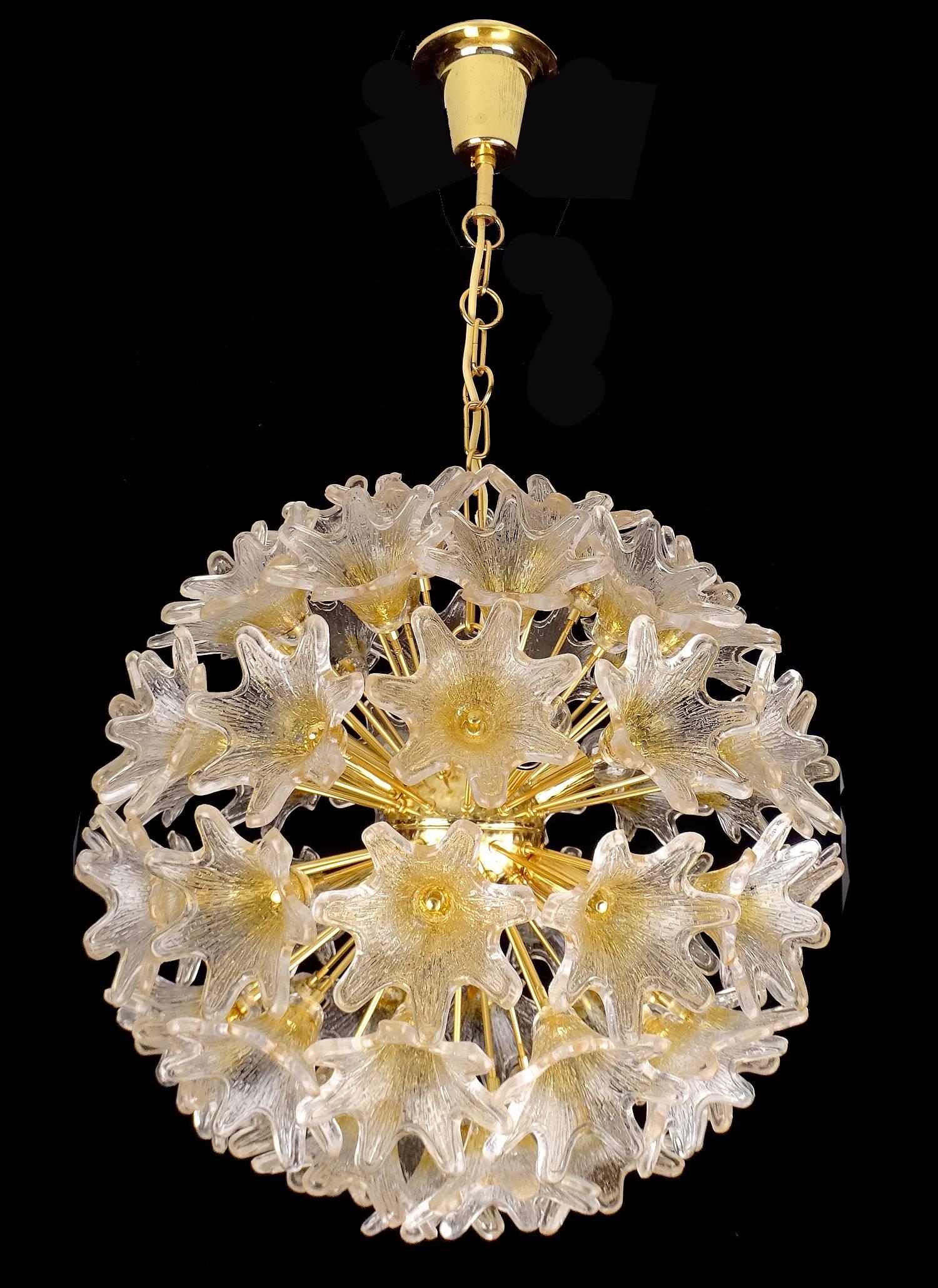 Stunning  Floral sunburst / starburst  chandelier by VeArt Venini featuring multiple Murano glass flowers on a brass structure . 

Dimensions
34.65 in H / 88 cm H
Diameter
19.68 in. (50 cm)

Eight candelabra size bulbs, 40 watts each. LED