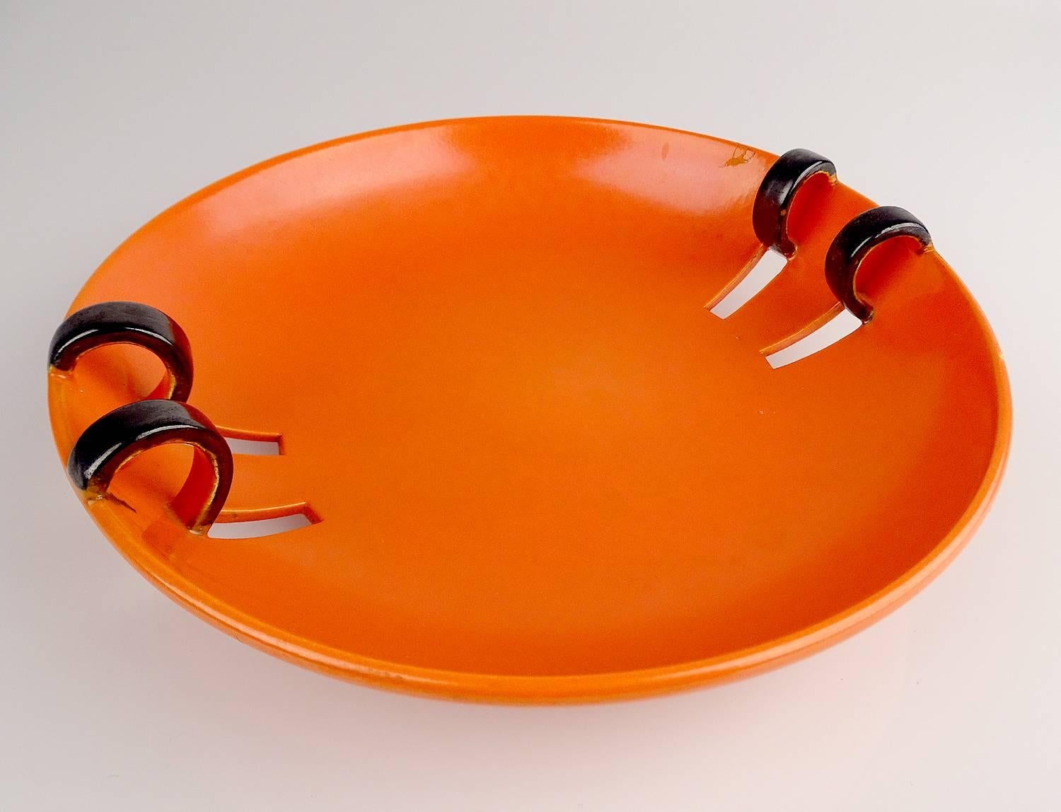 An Art Deco ceramic blow, circa 1928-1930, very rare Bauhaus orange colour with extruded loop handles 

The Art Deco style name was derived from the Exposition Internationale des Arts De´coratifs et Industriels Modernes, held in Paris in 1925,