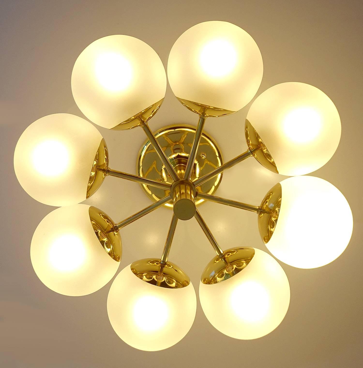 Elegant Kaiser sputnik chandelier / flush mount light . Circular Brass frame with eight satinated opaline glass globes 
11.81 in.H / 30 cmH
Diameter
20.08 in. (51 cm)
Eight candelabra size bulbs, 40 watts each - All our lights electricals are