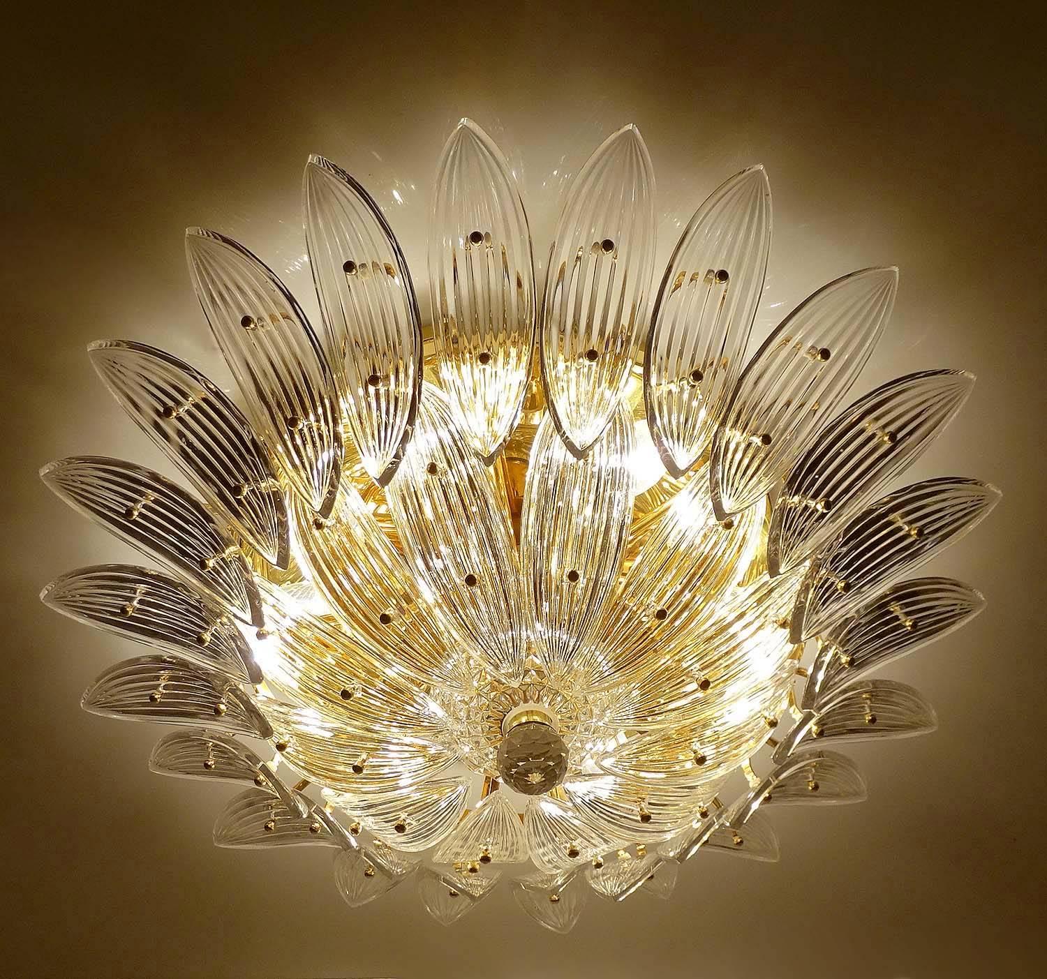Very large palmette flush mount light by Barovier and Toso with an oversize flower motif made out of palm leaf pattern Murano glass petals over a gilded brass structure. 

Excellent condition, 

six candelabra size bulbs up to 40 watts each. LED