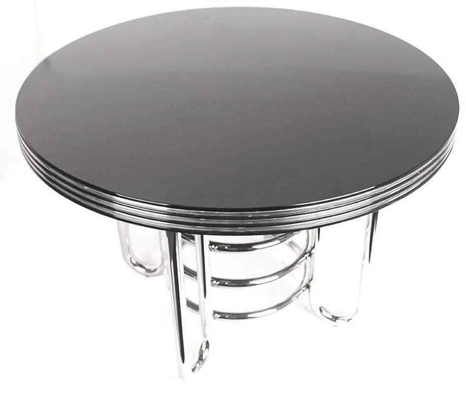 Very nice and unusual Art Deco Modernist  coffee table with a black glass top and tubular design, this was probably manufactured in the art deco revival era in the 1970s

The Art Deco style name was derived from the Exposition Internationale des