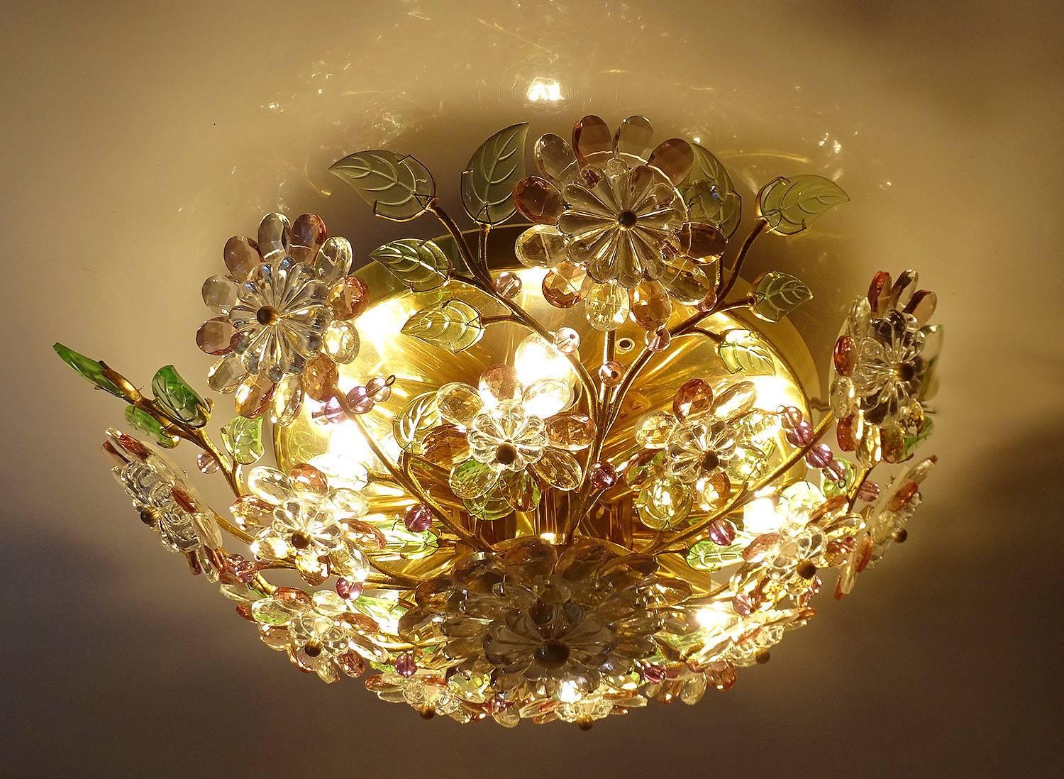 Exceptional, delicate flush mount light with a flower and branches, based on Italian millefiori designs, This lamp features eight branches with each three ramifications adorned with glass leaves and flowers of different sizes made out of molded and