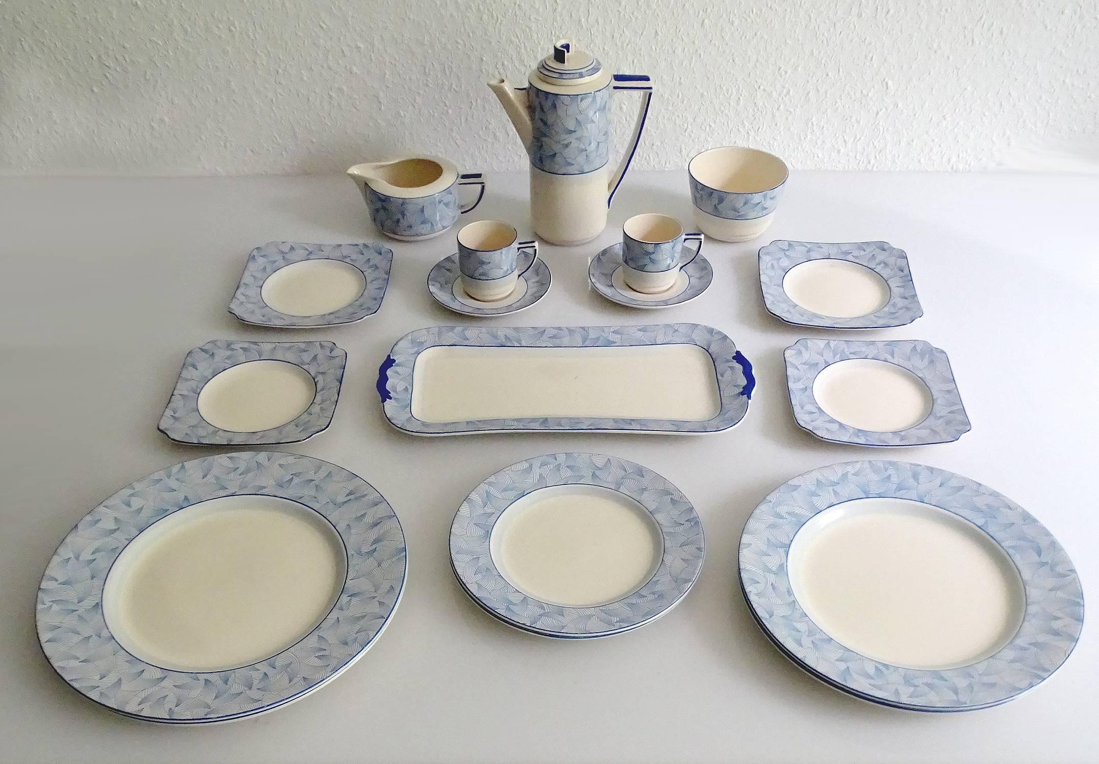 Art Deco modernist porcelain dinnerware / coffee set for two (Tete-a-Tete) manufactured by Royal Doulton during the 1930s. The design is called Envoy with stunning ultra marine patterns ressembling winglets or sails. this set is part of Royal