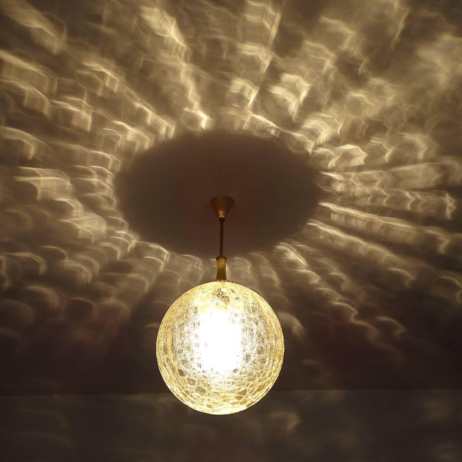 Large mid century modern Doria pendant light with a signature handblown structured glass shade (Doria called this pattern crocodile skin).  Great lighting effect.
25.59 in. / 65 cm H
Diameter
11.81 in. (30 cm)
One standard size bulb up to 100