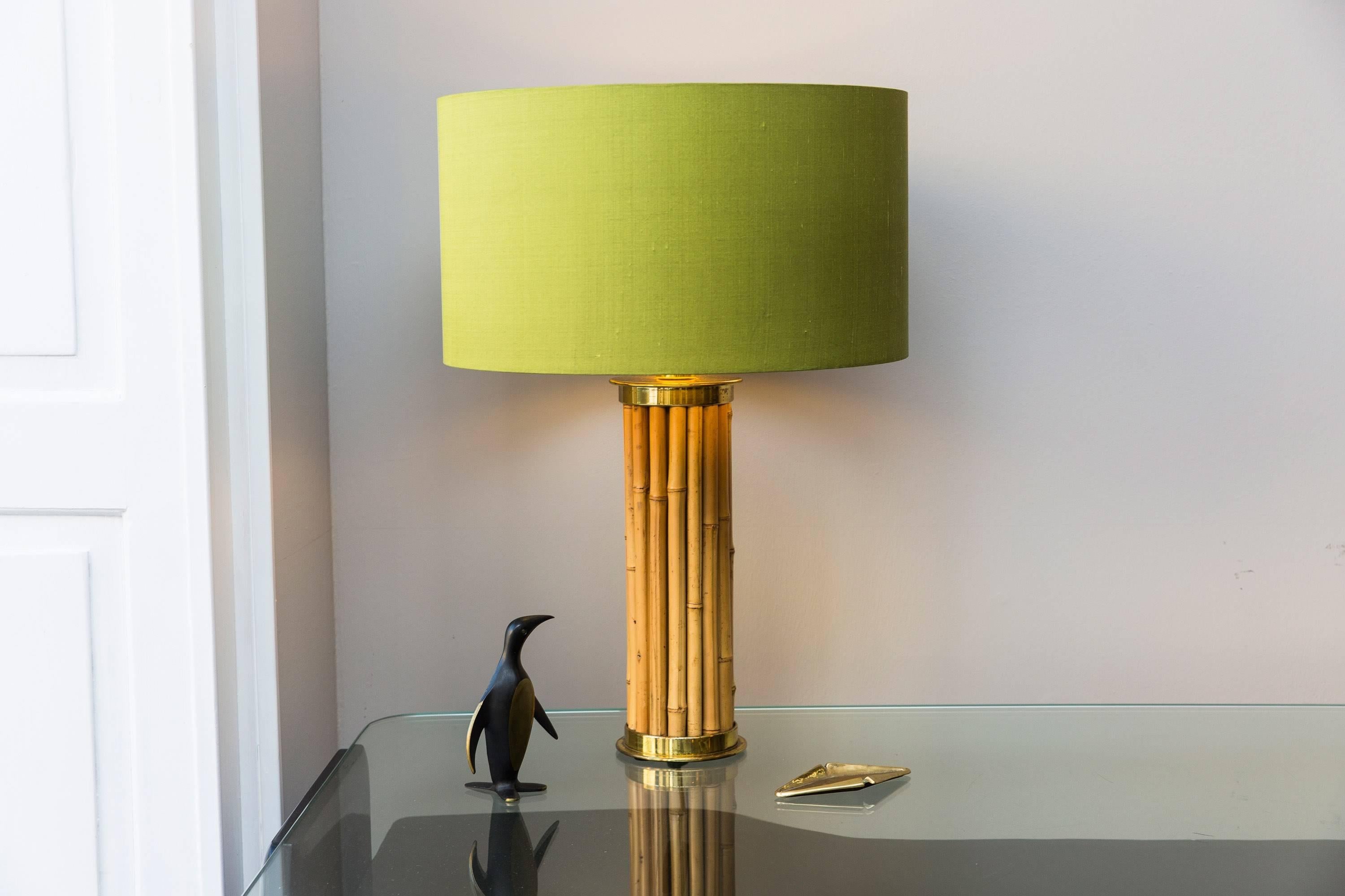 Elegant table lamp in the style to Gabriella Crespi, Italy, circa 1970, "Bamboo," Bamboo shoots, brass, new made shade in green wild silk by Zimmer&Rode. 
Measures: Height 72 cm / 28.35 inch, diameter shade 50 cm / 19.7 inch, diameter