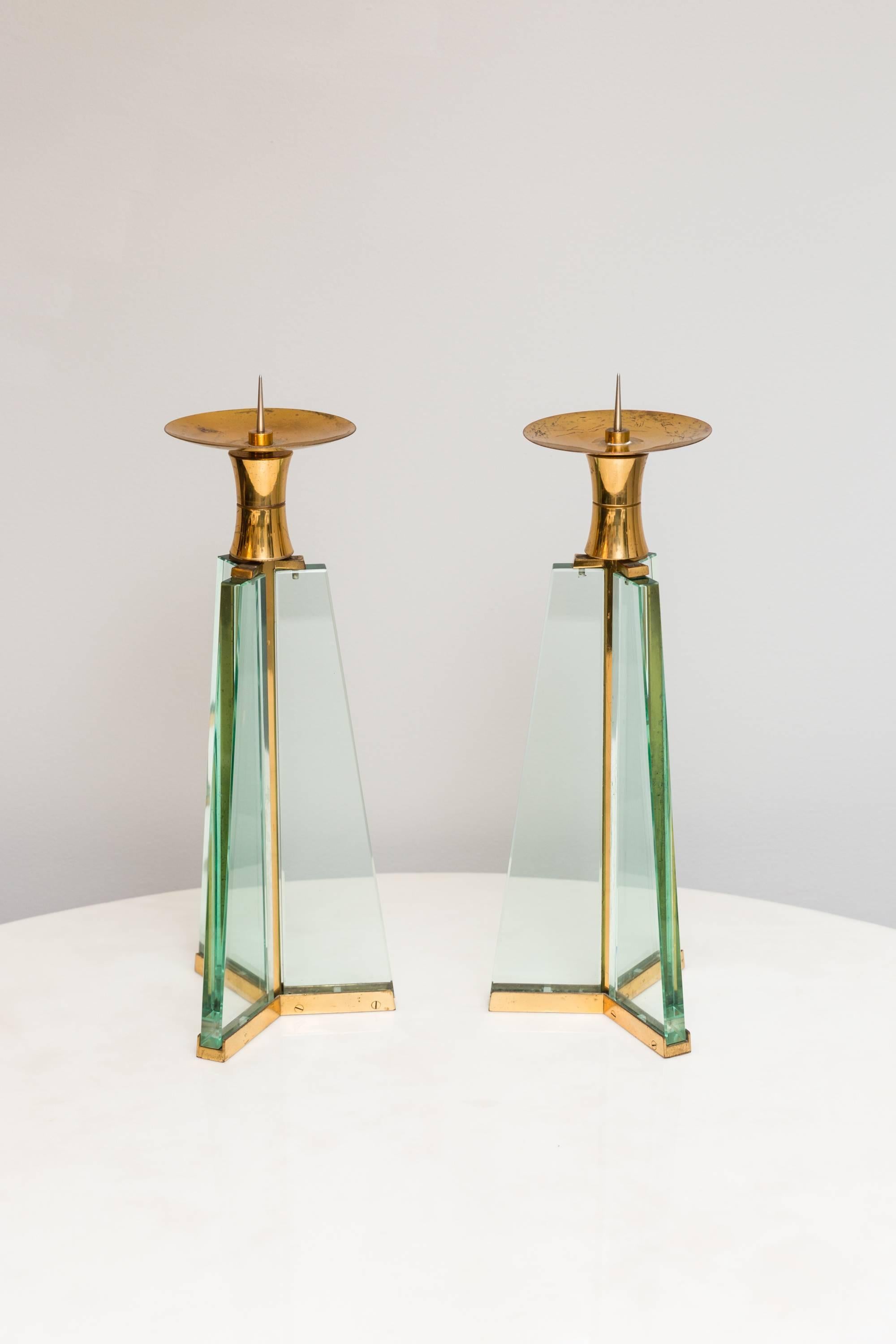 Rare pair of Fontana Arte, candle holder, glass, brass. Very good vintage condition. 
No chips in the glasses, light patina on the brass. 
Very rare to find!