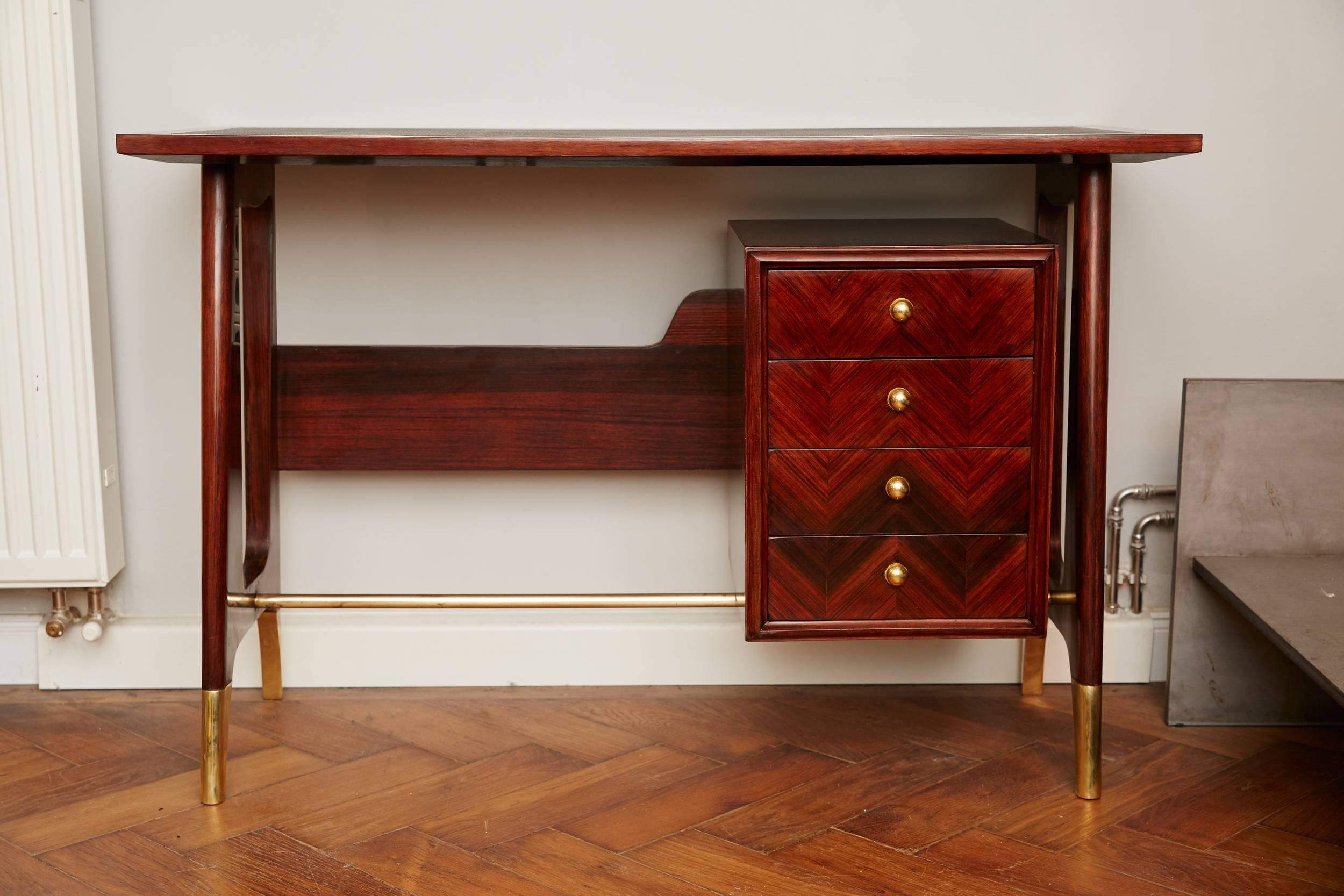 Elegant Writing Desk, Italy circa 1950, attr. to Ico Parisi, Santos rosewood polished, solid brass legs, brass rod, four drawers with brass ball handles elegant organic shaped side panels, brown leather writing tabletop. Perfect restored! 