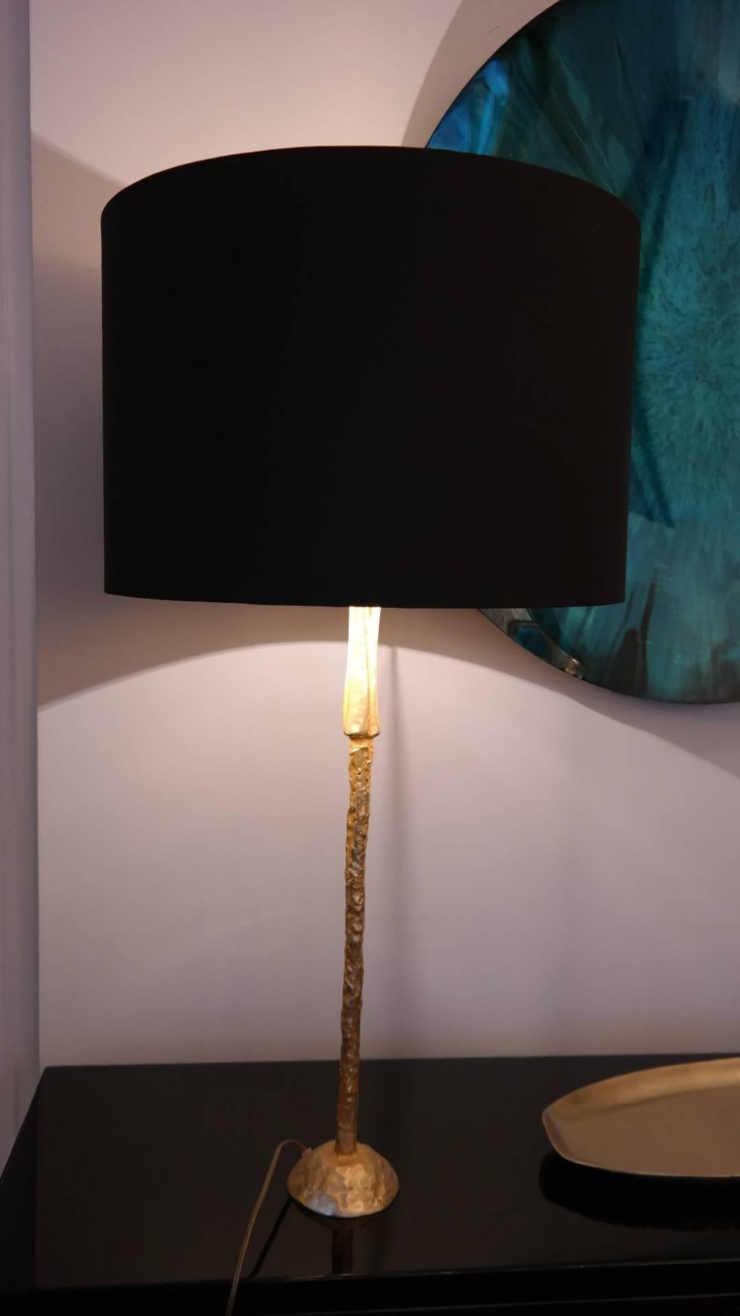 Elegant table lamp by Pierre Cesenove, France circa 1990, gilded bronze, new black silk shade inside gold, signature at the base.
Measures: Height 90 cm, diameter shade 48 cm, height shade 32 cm, height lamp without shade 64, diameter base 12