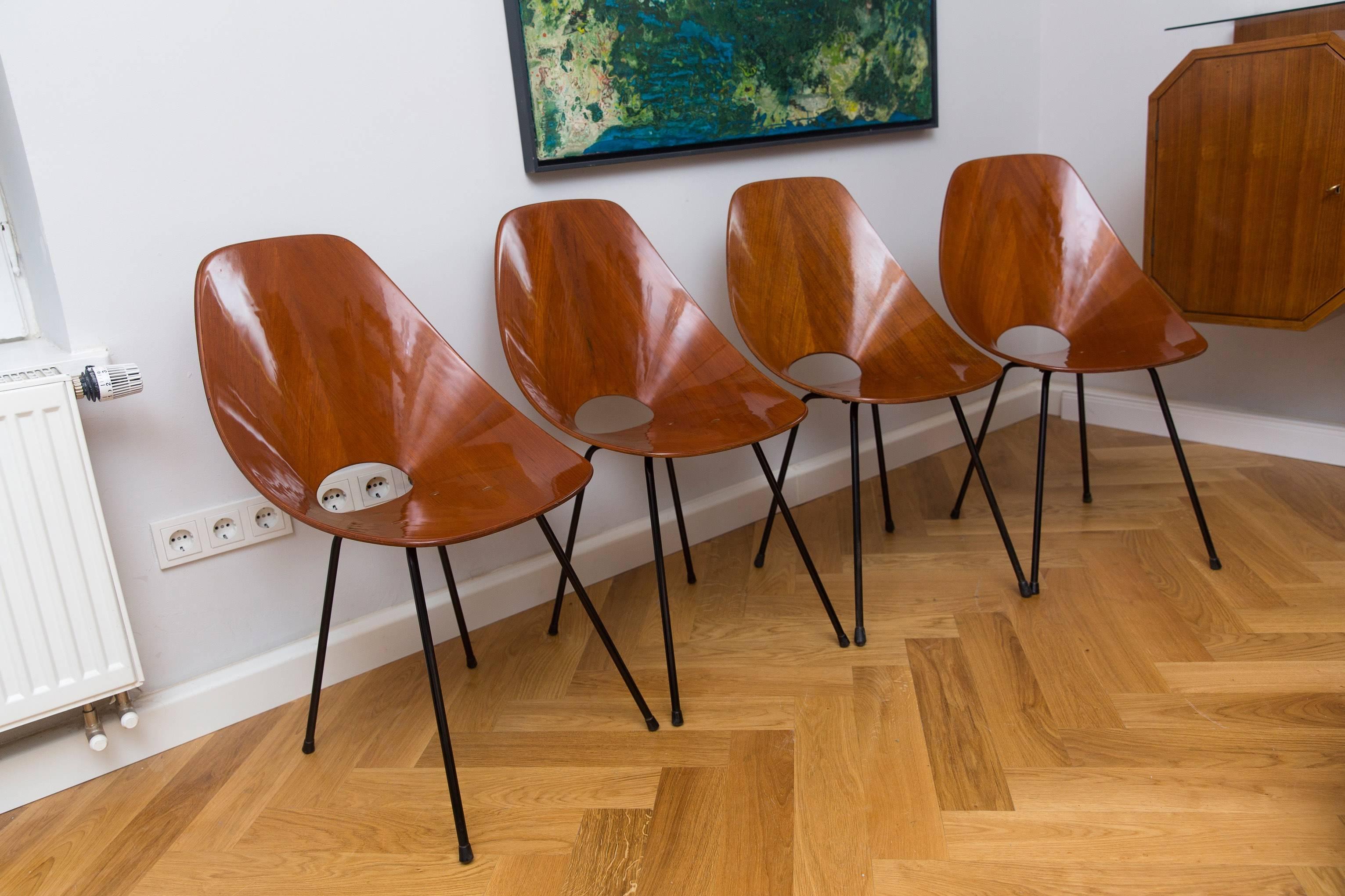 A very elegant set of four Vittorio Nobili Medea chairs, Italy, circa 1960, lacquered Palisander wood, black lacquered metal legs, signed Medea backside on the bottom of each chair. All chairs are restored and in a very good condition.