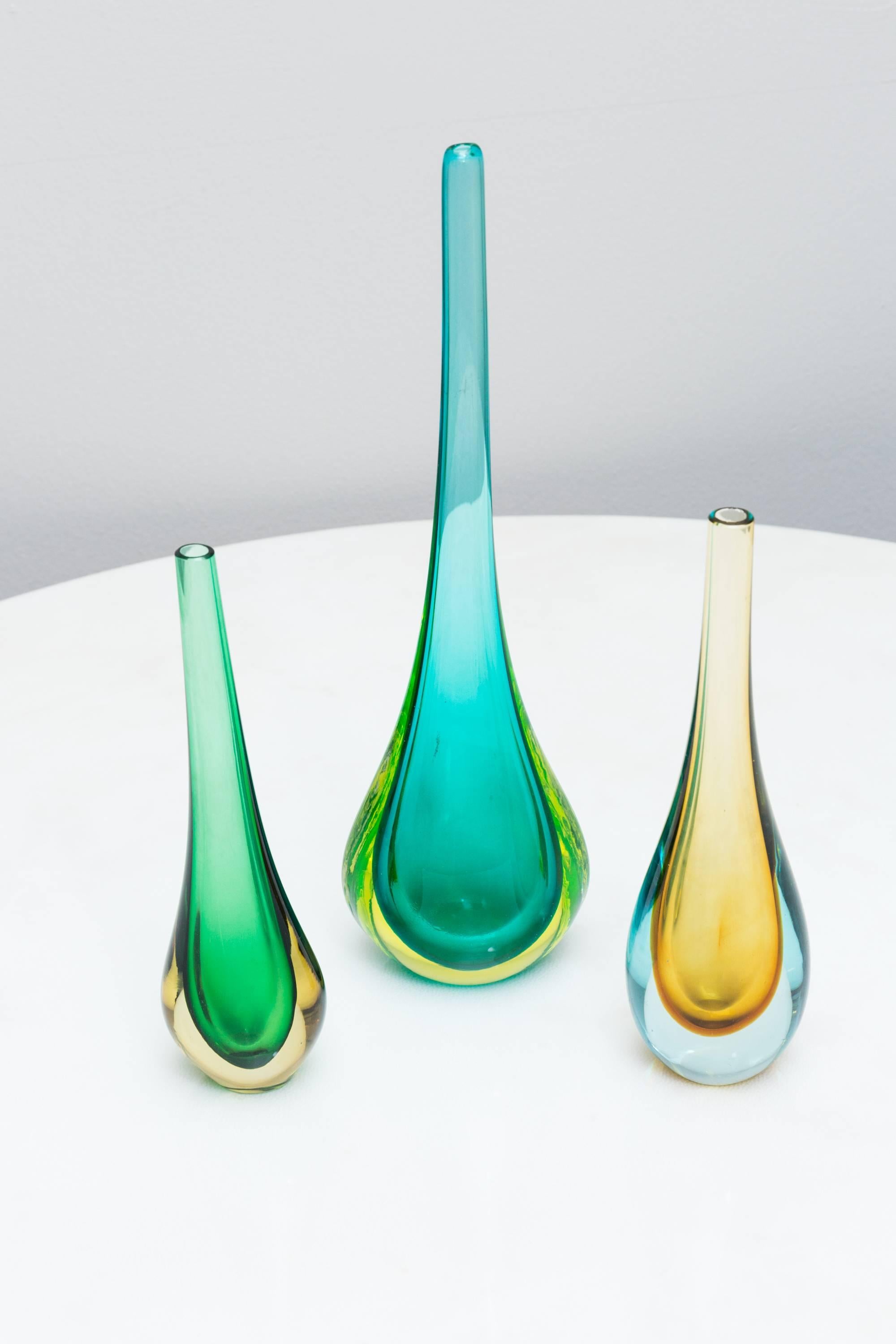 Elegant rare set of three multi-color, Murano glass vases by Flavio Poli, Prod. Seguso, Italy Murano, circa 1960.
Each vase have three different colors
turquoise, light green, amber-yellow, green, clear glass
The vibrant colors and the different