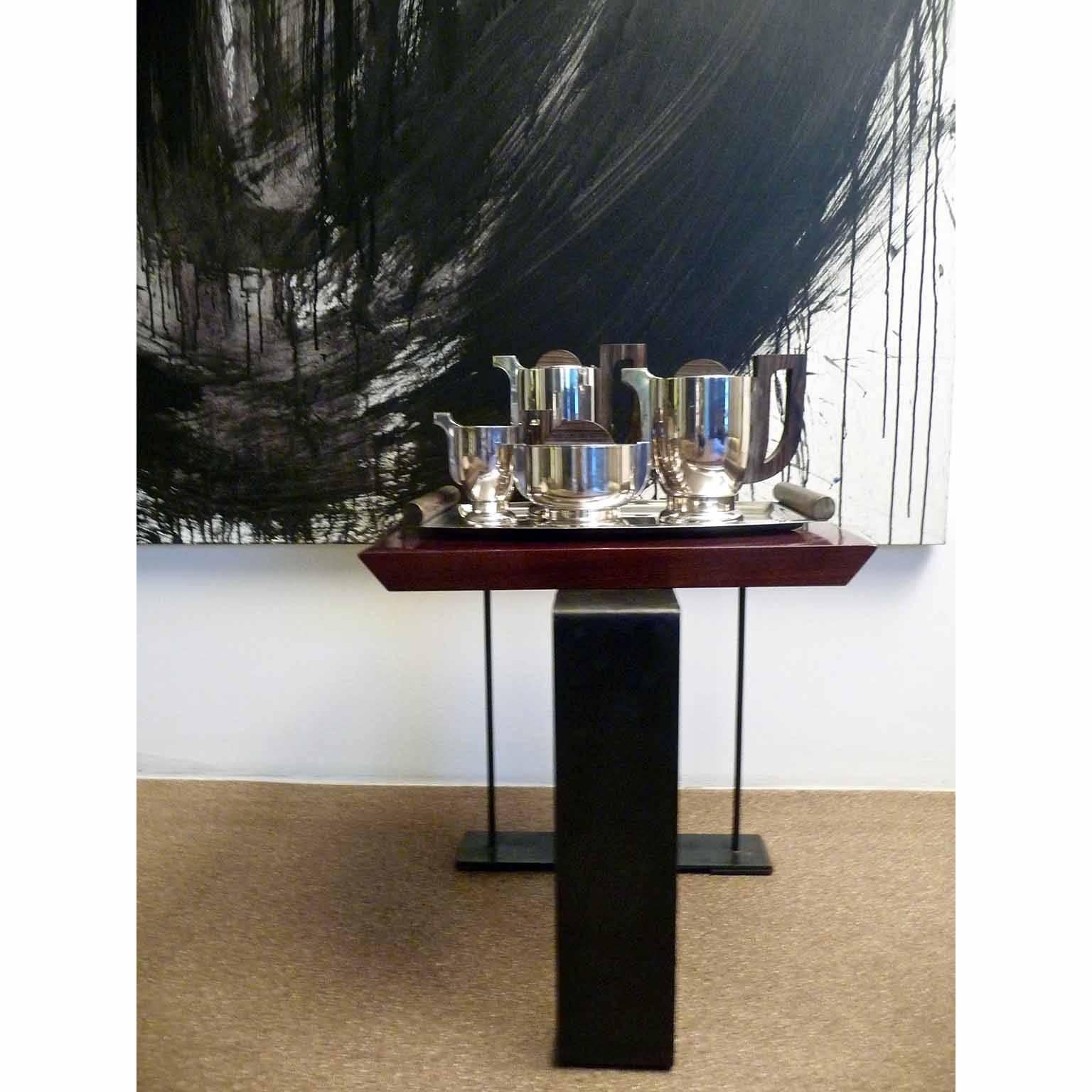 Exceptional Art Deco design tea or coffee service by the French orfevrerie Apollo.
Silver plated metal and Macassar handles, this service is a masterpiece.
Each Item marked with maker's mark, form number and silver plating quality