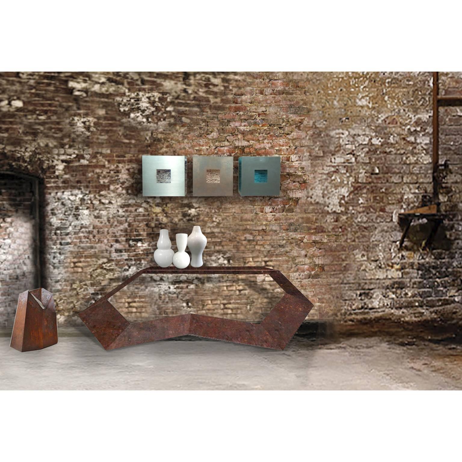 Wall mounted sculptures patinated iron 