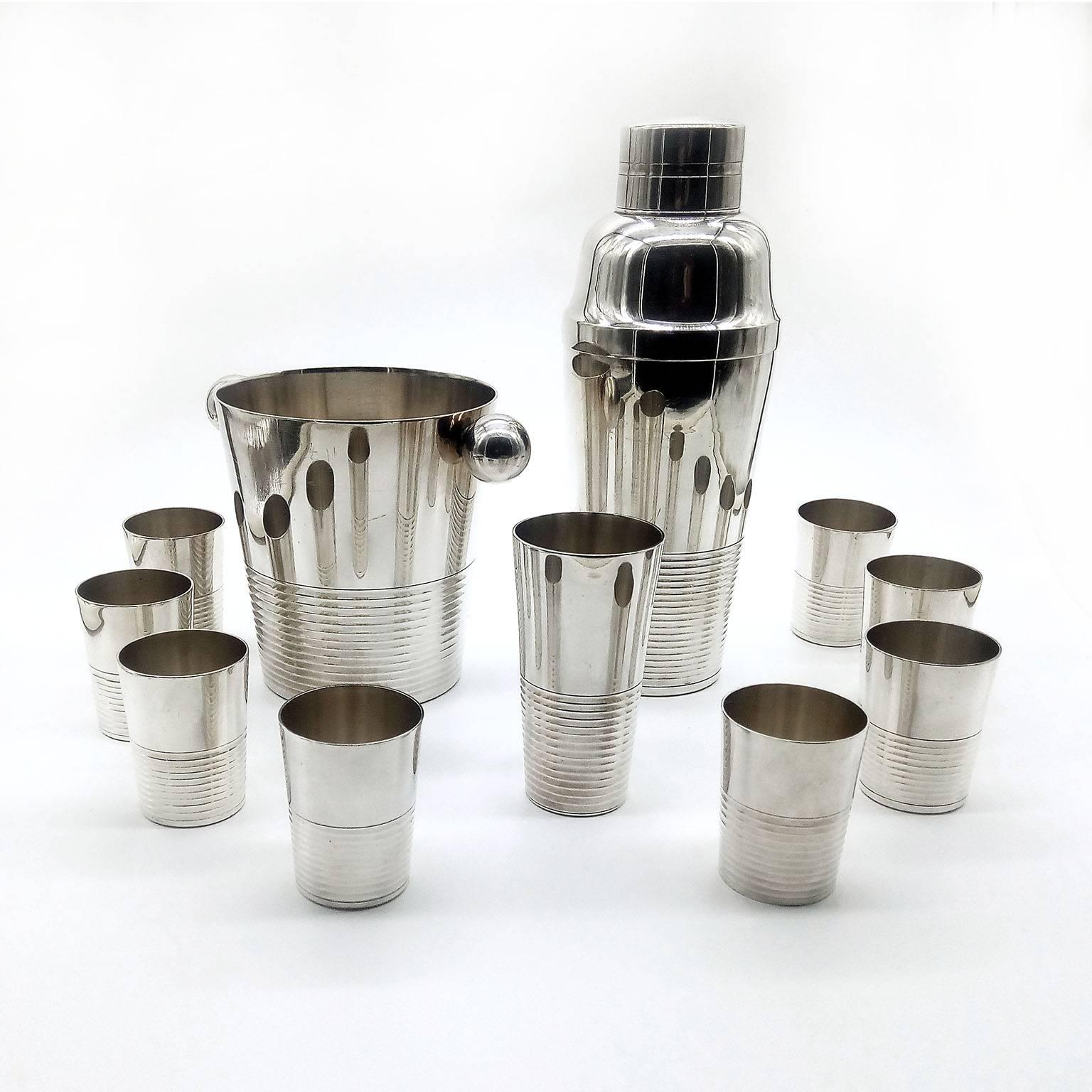 An exquisite and rare Art Deco cocktail set by Kirby Beard Paris, comprising a cocktail shaker, an ice bucket, a measure and eight beakers. Hard to find in this quality and complete.
Each piece marked under the bottom with maker's hallmark and