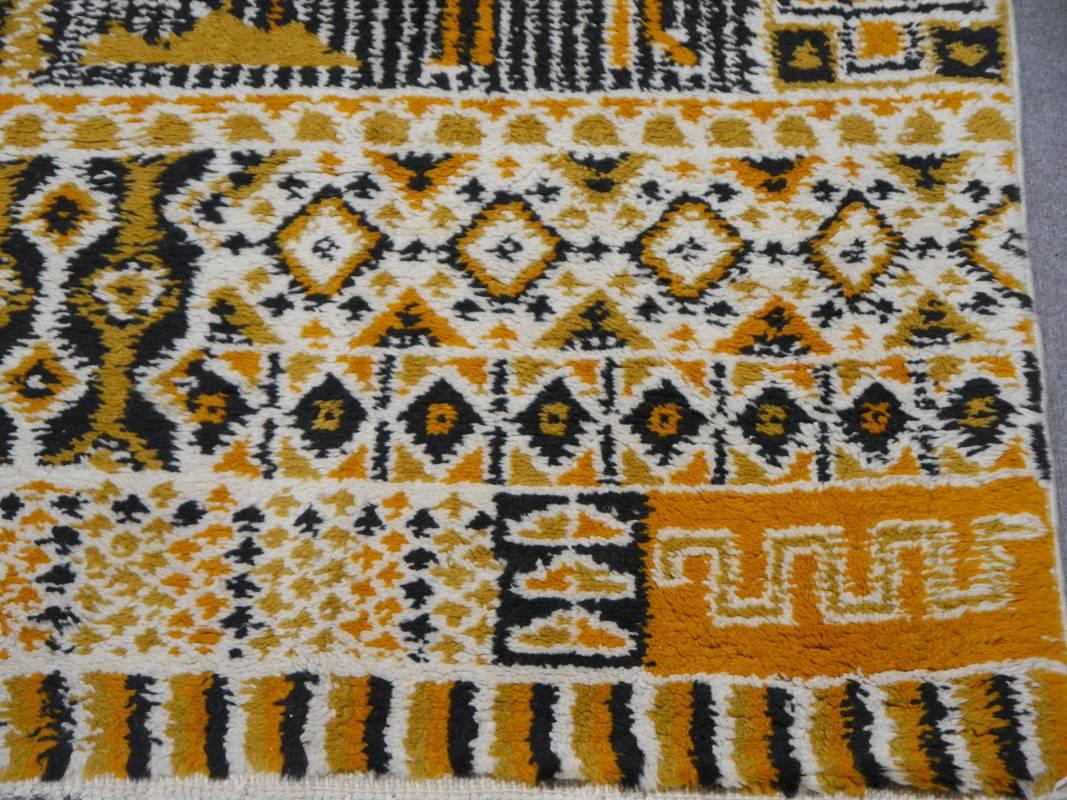 One of a kind tribal Moroccan Berber rug from the area around the town Rabat. Hand-knotted by women using wool and traditional designs.