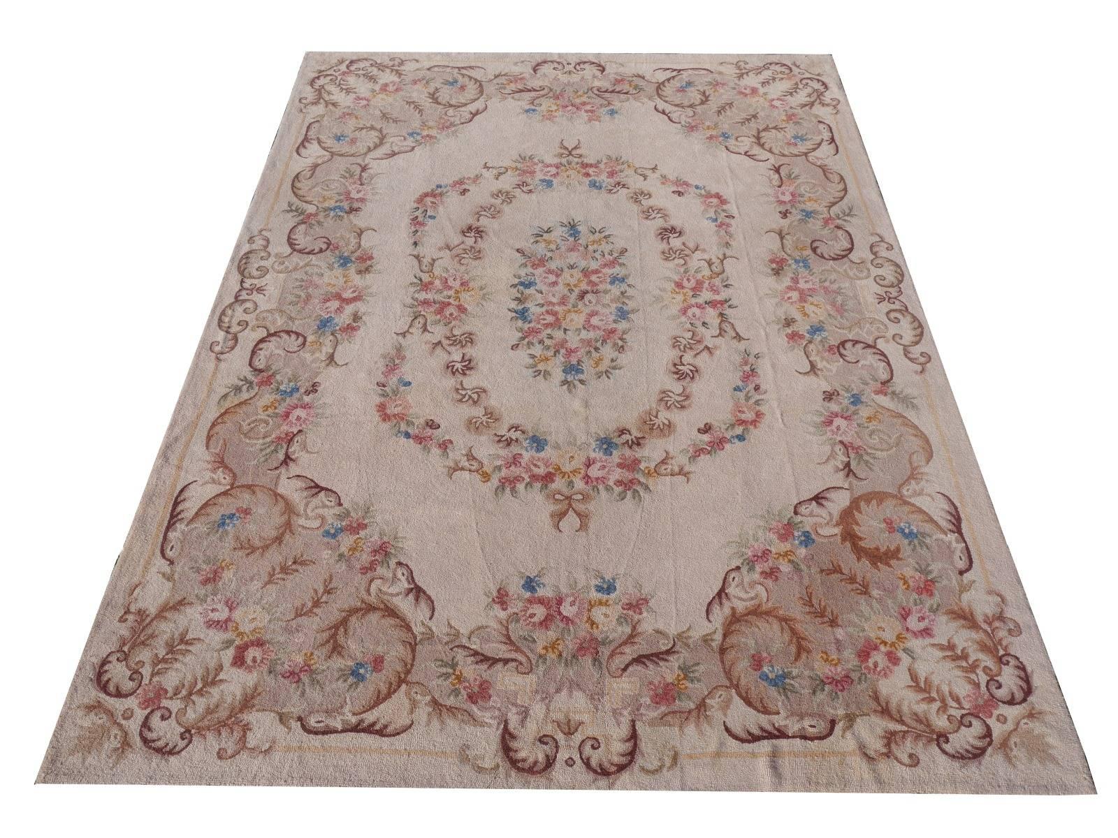 We are offering a one of a kind needlepoint rug, handmade in Portugal. It is from the Arts & Crafts period in the mid 1920s. The design is strongly influenced by frensh Savonnerie carpets of the 19th century. The condition is exquisite (very small