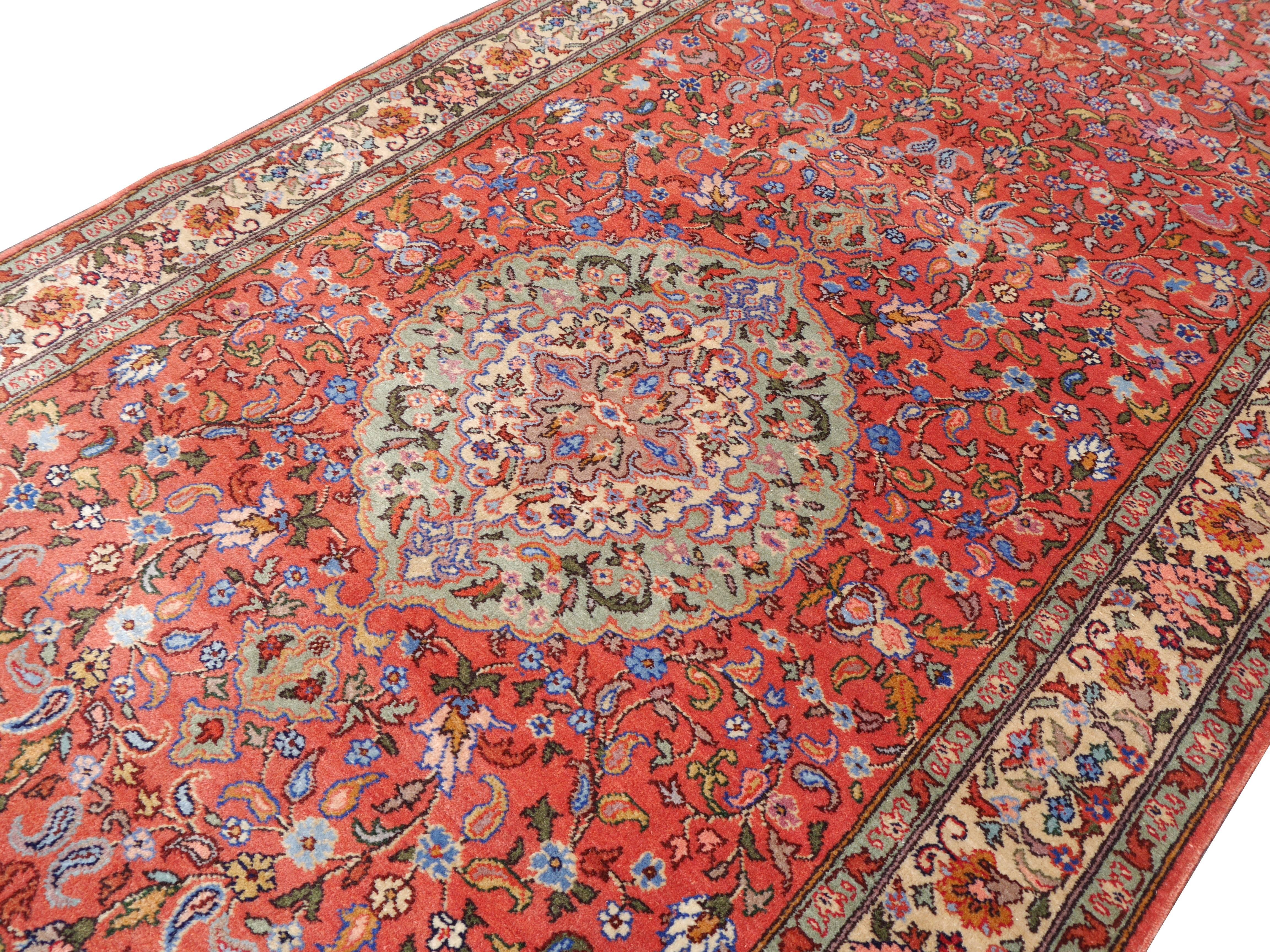 Very unusual Romanian hand-knotted rug with Persian Tabriz design. Since the mid-20th century Romania was producing very nice and good quality carpets with oriental designs. This rare sized piece was made using traditional Tabriz motives.