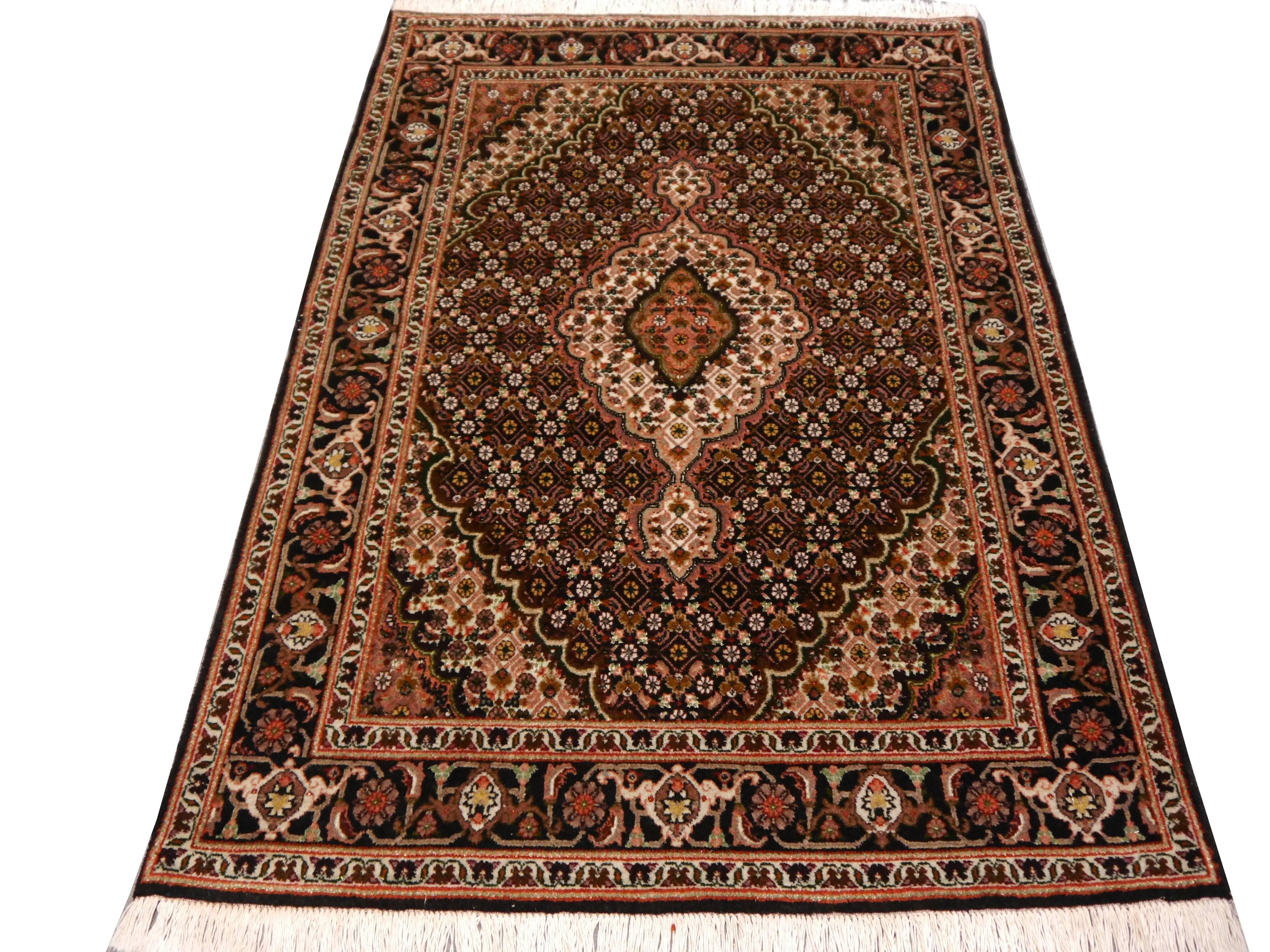 Fine Persian small sized Tabriz rug. Hand-knotted using fine wool and natural silk.