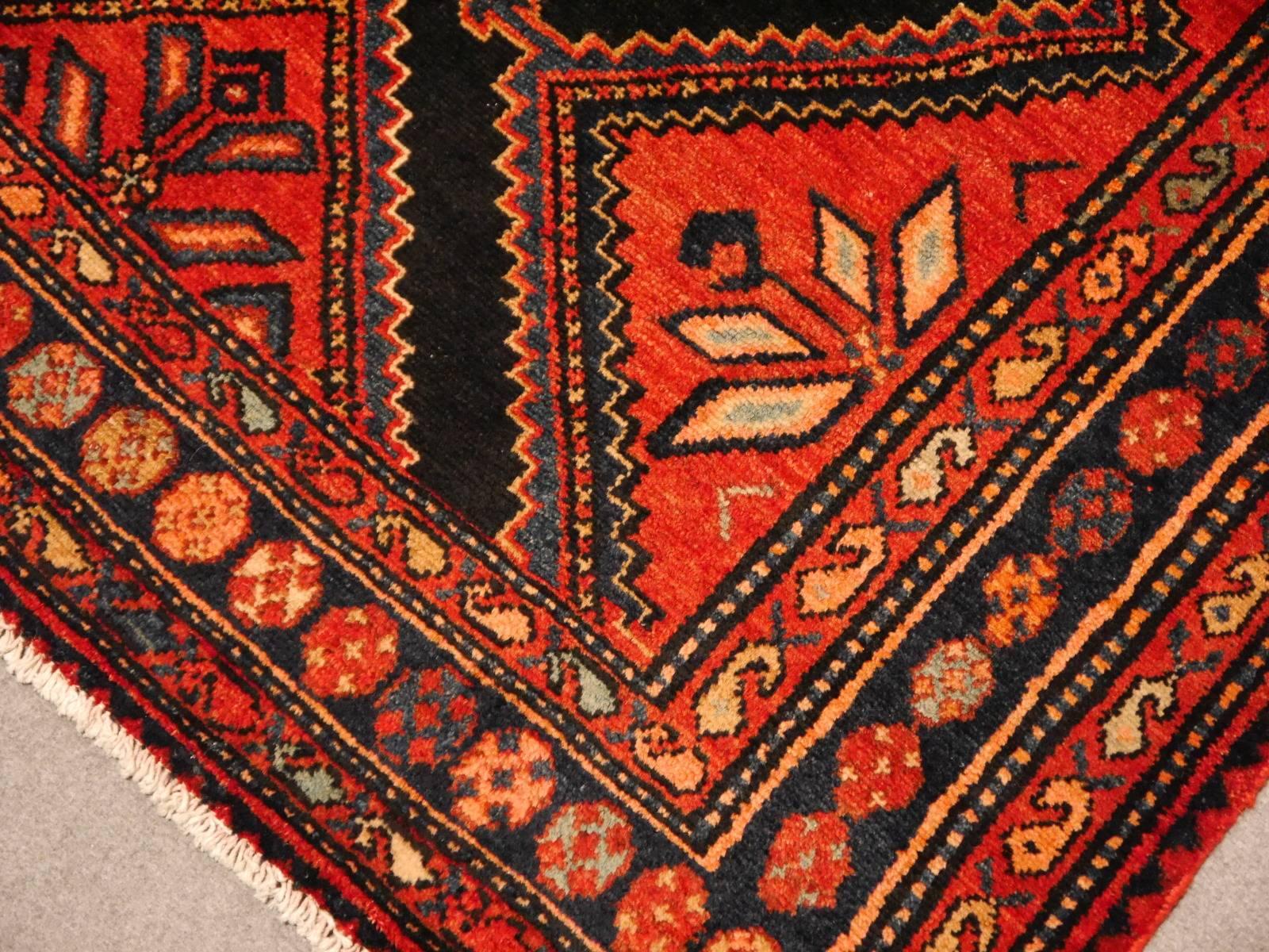 Beautiful hand-knotted vintage rug. The pile is made of fine, hand spun wool that was dyed with vegetable dyes. The rug is in very good condition.