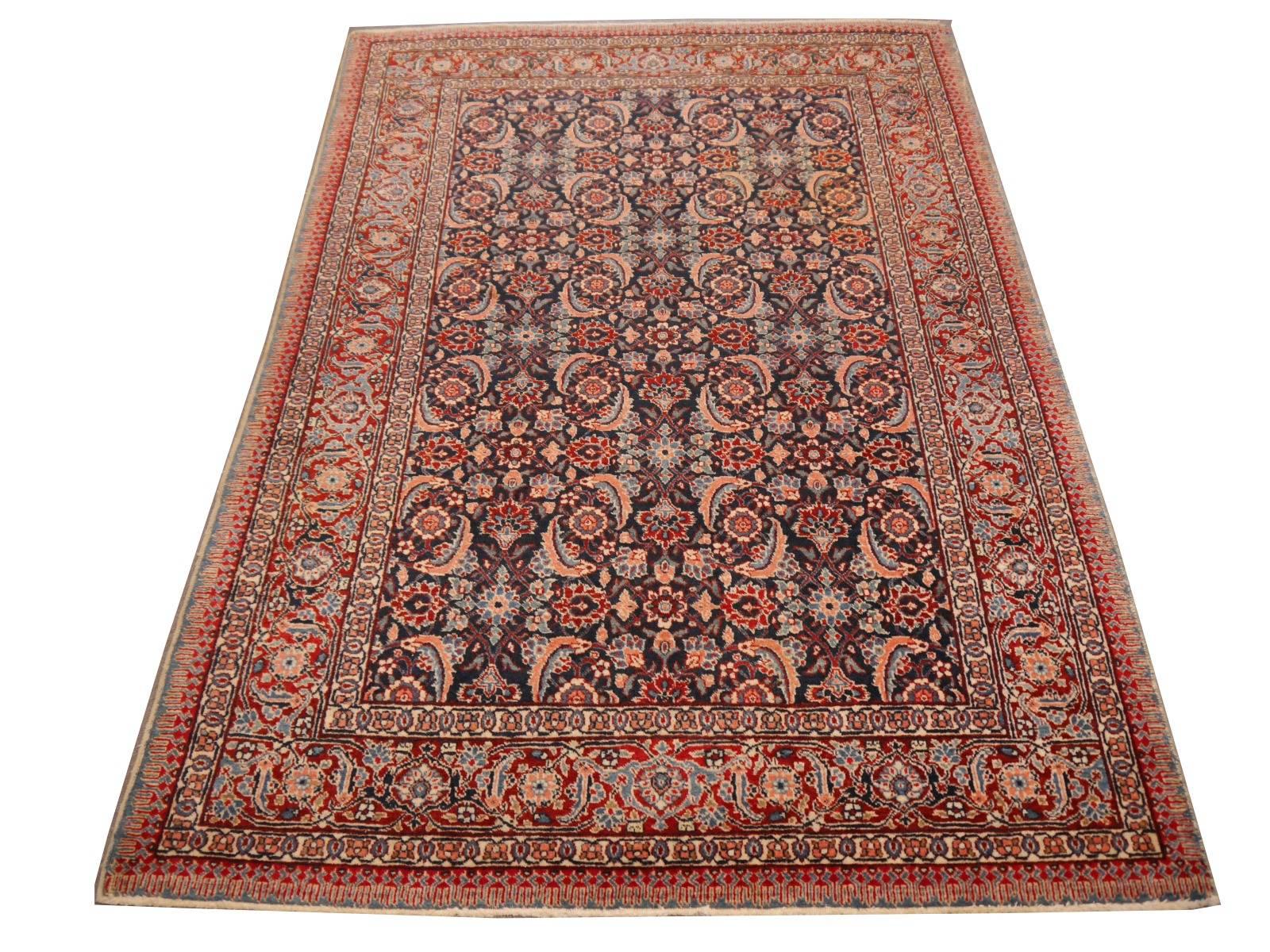 A beautiful antique rug from Azerbeijan. It was hand knotted using highland wool from the Azerbaijan District which is located between the Caspian sea, the Caucasus Mountains and the Turkish Border. The background color is a decent Jeans - Blue,