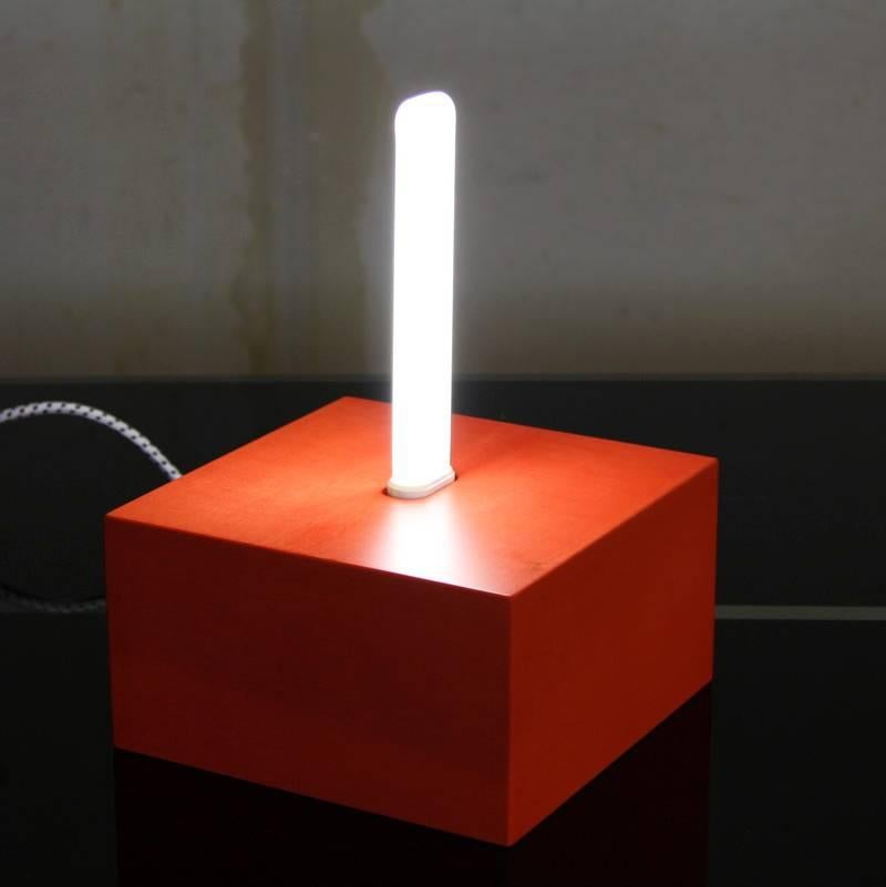The Jagati lamp designed by Ettore Sottsass, Italy, 2000.

Lacquered wooden box with a neon light.