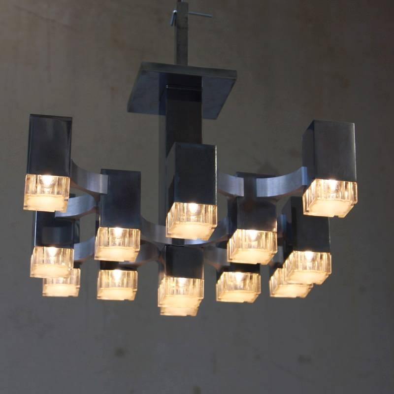 Very early nickel-plated ceiling light designed by Gaetano Sciolari in the late 1960s, Italy.

Dramatic construction with 13 light fittings, designed and produced by Sciolari.

While the company 