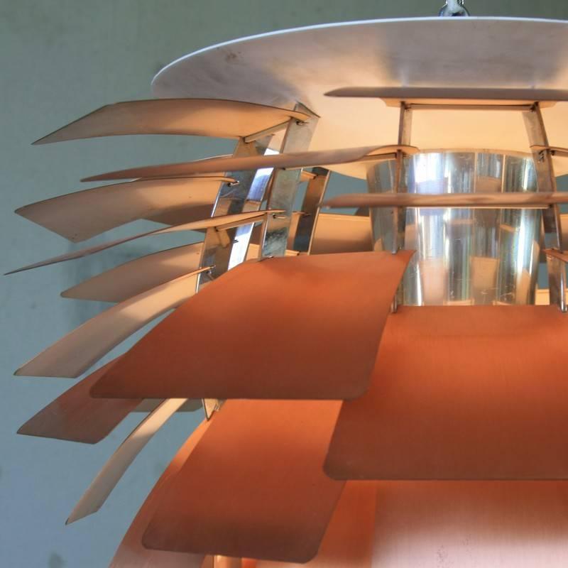 PH Artichoke lamp, designed by Poul Henningsen for Louis Poulsen, Denmark (1958).

This lamp dates from the 1970s, copper leaves and chrome plated diffuser with E27 light fitting.
Condition: 

Good vintage condition, leaves marked due to age.
 