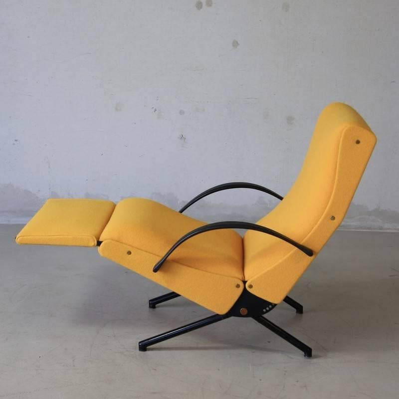 Reclining armchair designed by Osvaldo Borsani, Italy, 1955.

The 'P40' variable tilt armchair, produced by Tecno, Milan starting 1956. Black tubular frame with rubber arm rests. Seat, back and footrest upholstered in yellow Kvadrat (Tonus). The