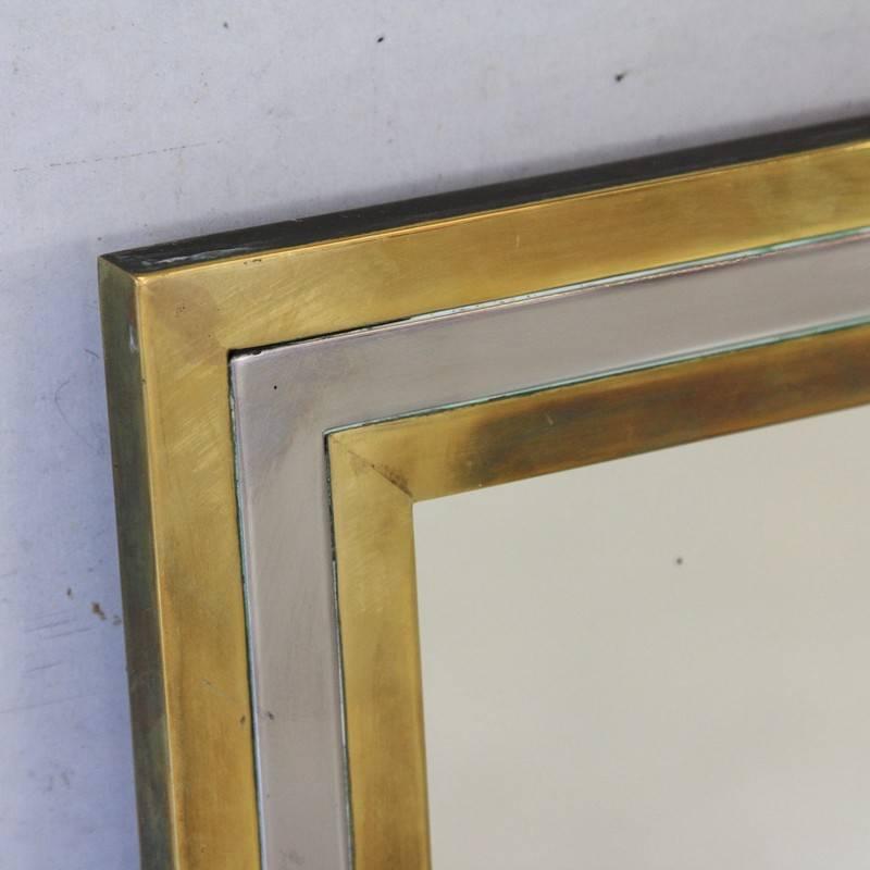 Brass and chrome framed mirror, Italy, 1960s.

Heavy welded brass frame with chrome detailing.