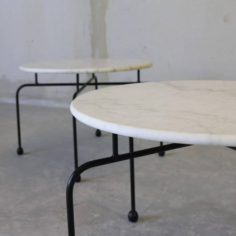 Pair of side tables, France, 1950s.

Painted metal base with round marble top. Size of the marble is 60 cm.