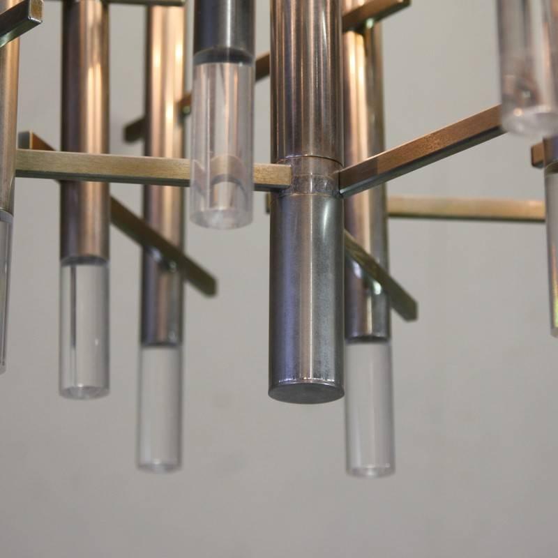 Nine light chandelier by Gaetano Sciolari, Italy, 1970s.

Metal and Perspex chandelier with nine light fittings. Signed Sciolari on label.
Condition: 

Vintage condition.

