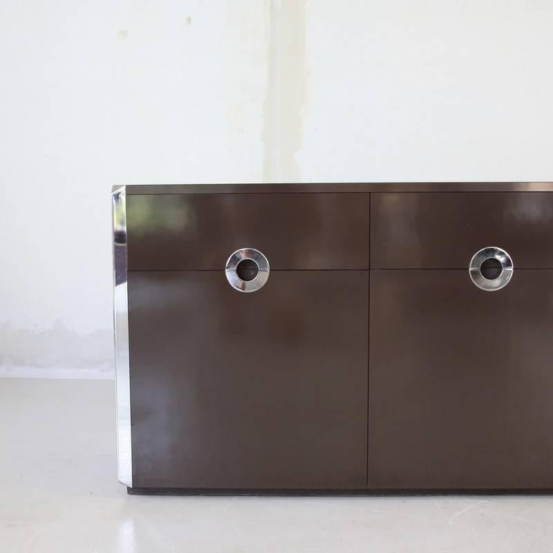 Brown laminate and chrome detailed sideboard designed in the style of Willy Rizzo and produced by Mario Sabot, Italy, 1972.

Three drawers and shelving. Edition limited to approximately 2000, Quite rare in this color! Reference: Casa Vogue, no. 19,