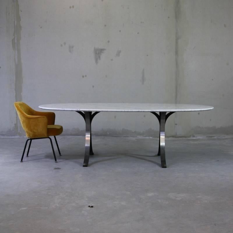 Large dining or conference table designed by Osvaldo Borsani in 1964. Produced by Tecno.

Two separate painted aluminium bases with brushed metal detail and Tecno stamp. Carrara marble top. Very elegant, heavy table.

Literature: Repertorio del