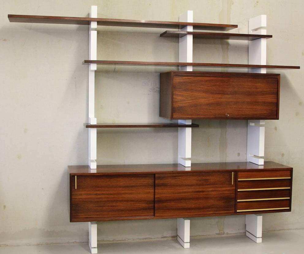 Bookshelve with rosewood cupboards and shelving, AMMA Italy, 1960's.

Rare modular shelving system by Amma. It can be extended continously, the shelving changed to suit individual needs. Fantastic!!!

The book case has been wonderfully restored.