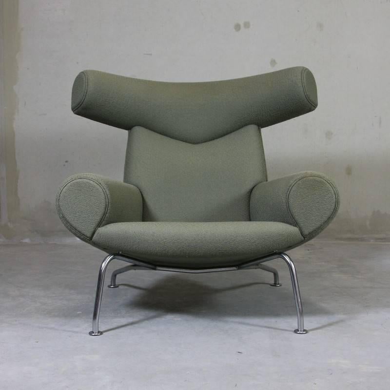 Armchair and foot stool, designed by Hans J. Wegner. Denmark, Erik Jorgensen, 1960. 

The 'Ox Chair' and ottoman with metal structure and a light green upholstery.

Reference: Hans Wegner's 100 Chairs by N. Oda, pp 94-95.

Dank mobelguide by