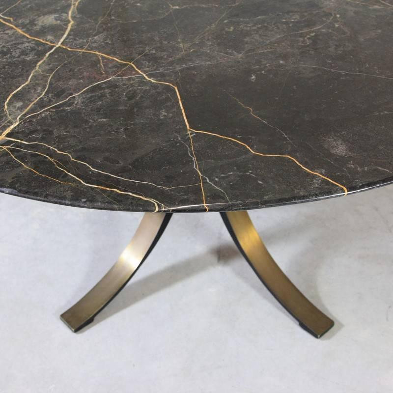 Round dining table designed by Osvaldo Borsani in 1964. Produced by TECNO.

Bronzed brass base with large (140 cm) round 'Port S. Laurent' marble top. Very elegant, heavy table.

Literature: Repertorio del Design Italiano, 2 vols, page 110,