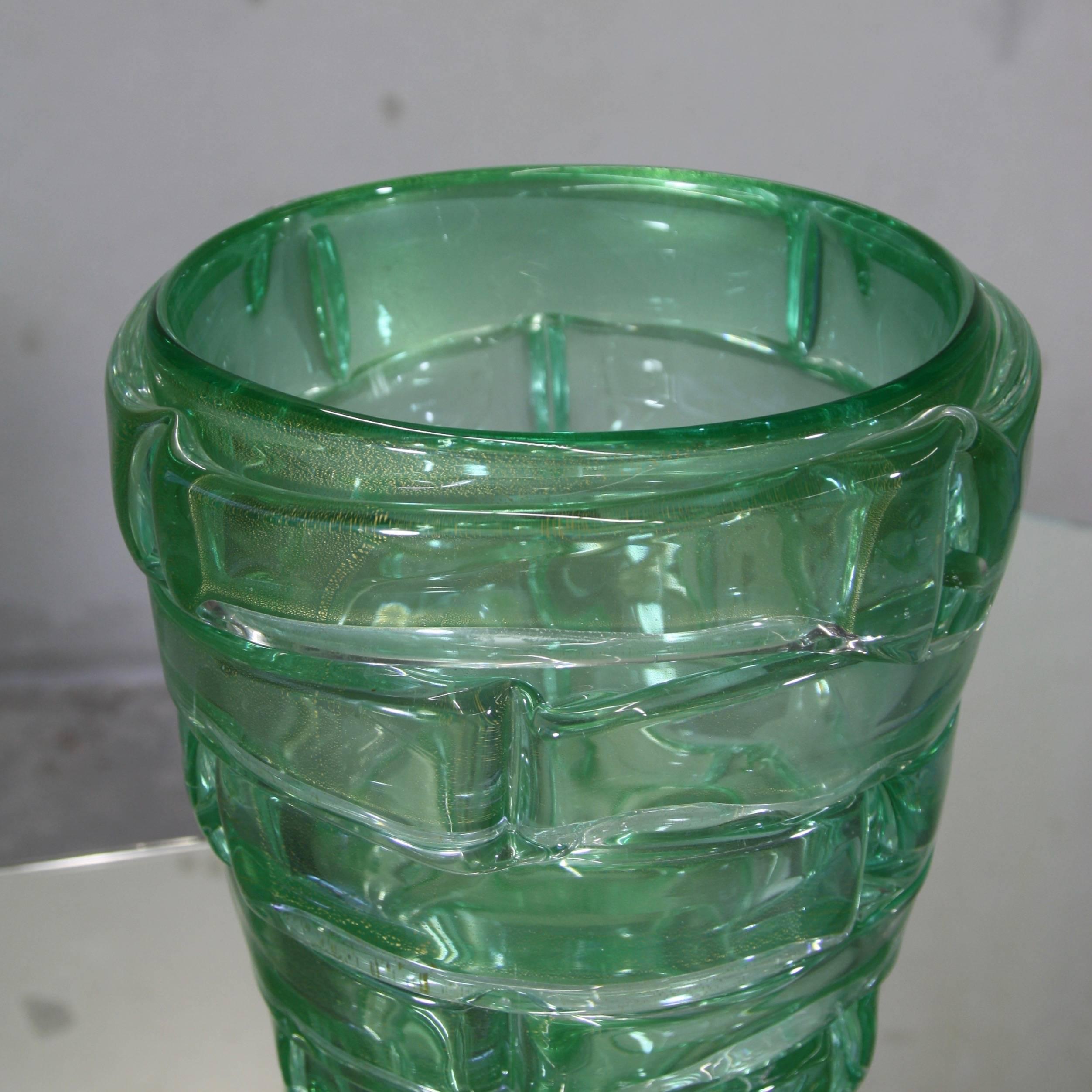 Large handblown glass vase, Italy, Murano.

Green glass with gold particles, engraved with signature underneath the base.
 
Condition: 

Excellent condition.
  